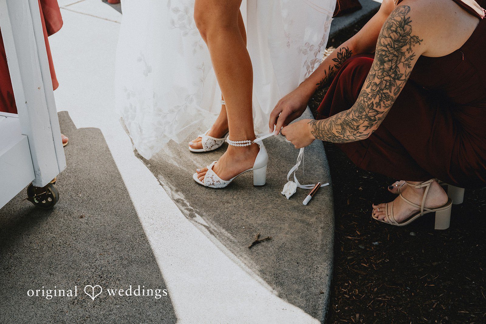 Bride slipping on her wedding shoes