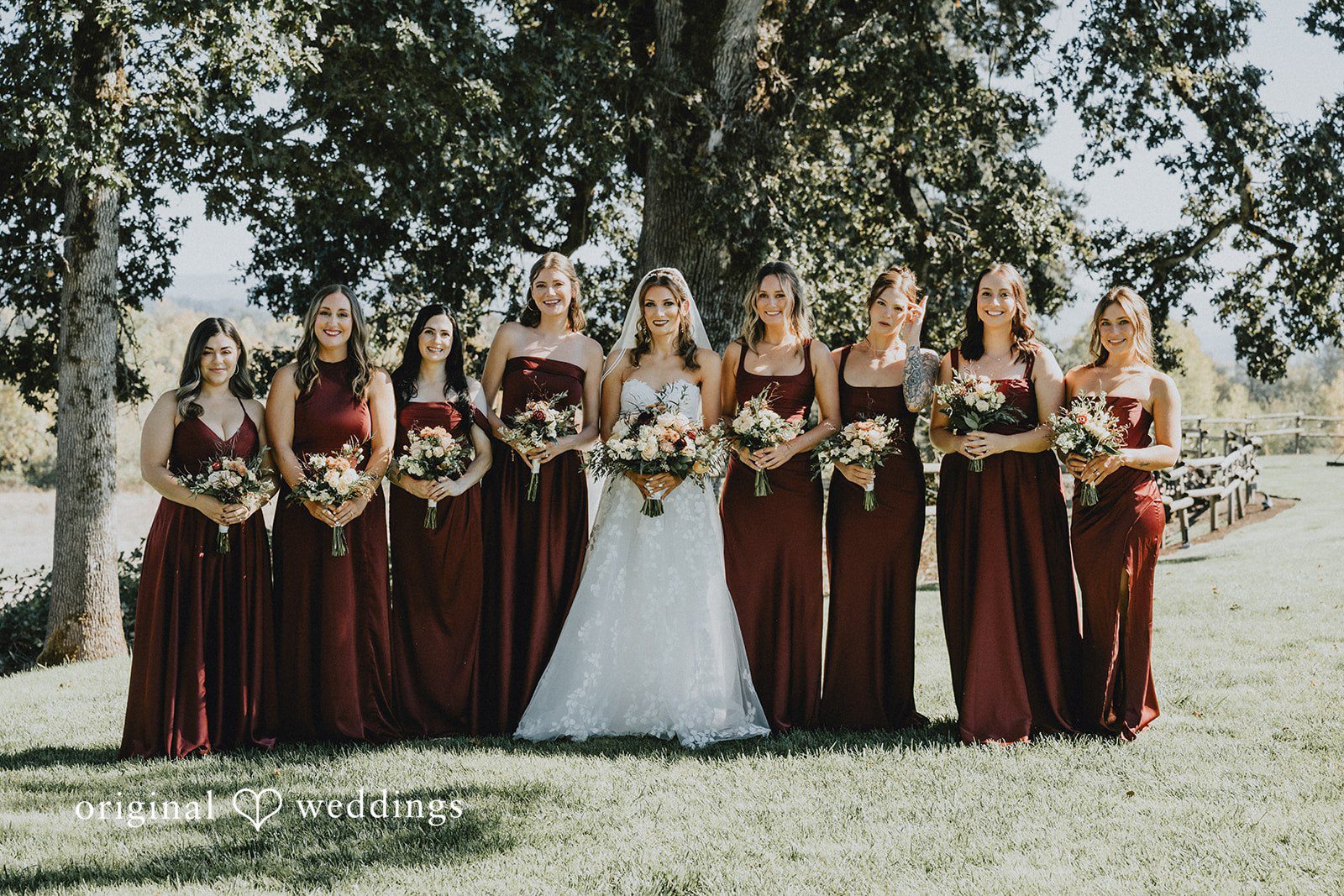 Bride with her bridesmaids in burgundy dresses at Oak & Hood
