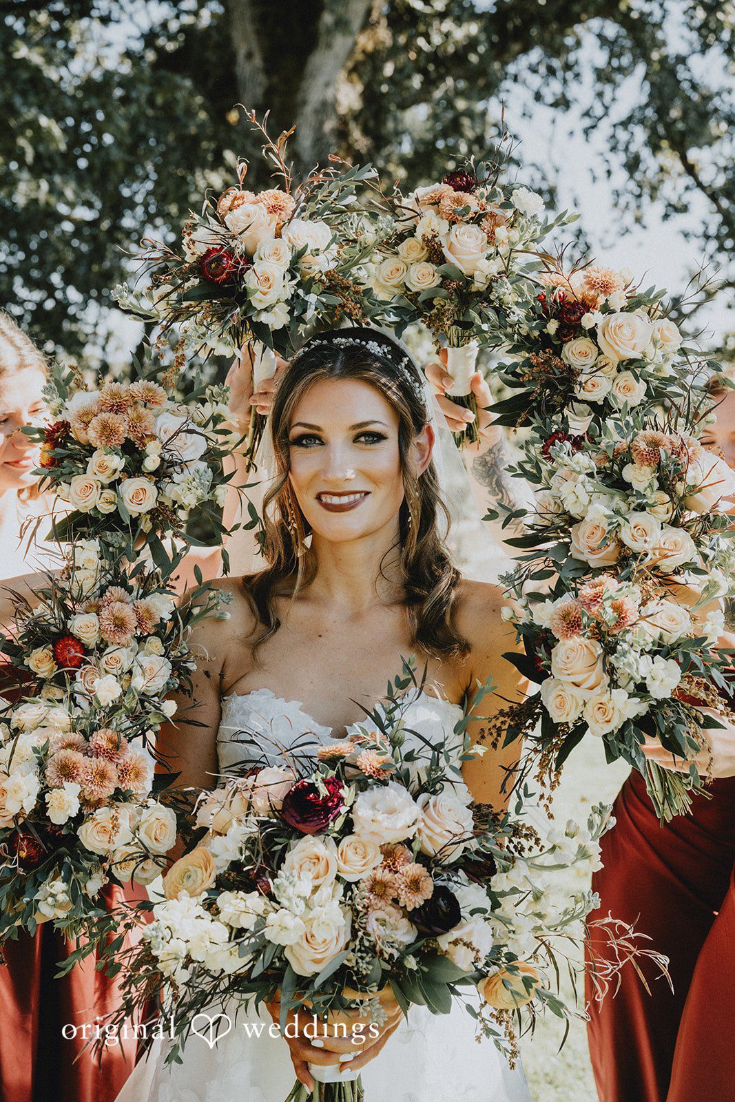 Bride smiling with her bouquet