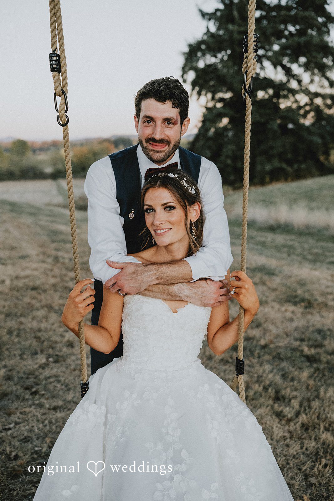 Groom lifting the bride with a smile