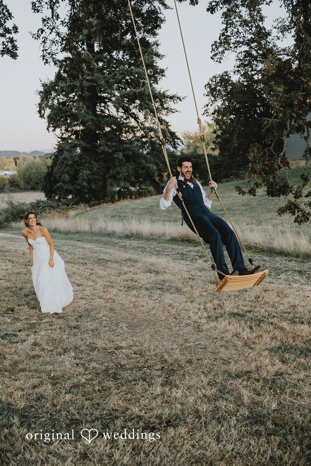 Couple sharing a playful moment in the field