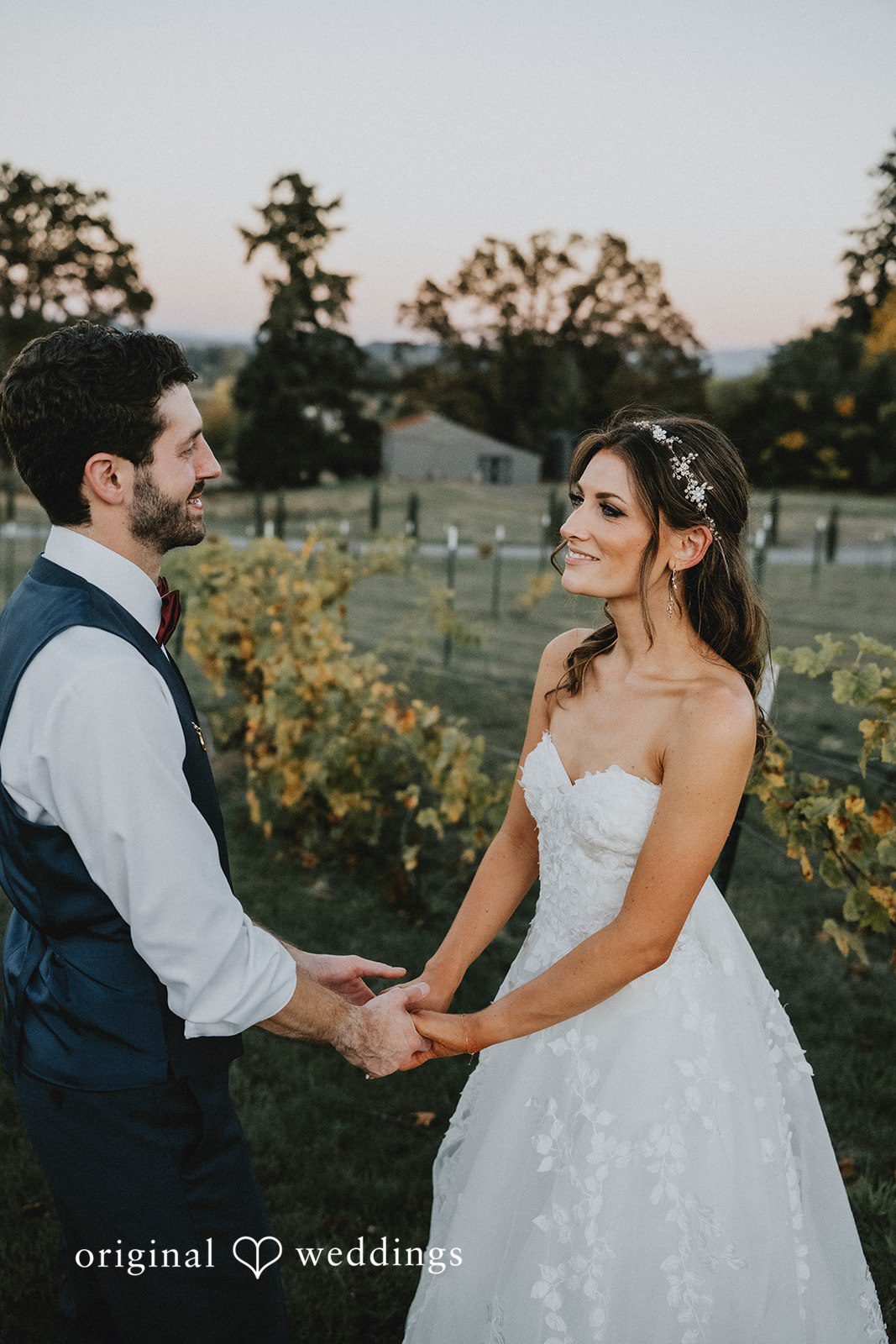 Couple holding hands during the vows