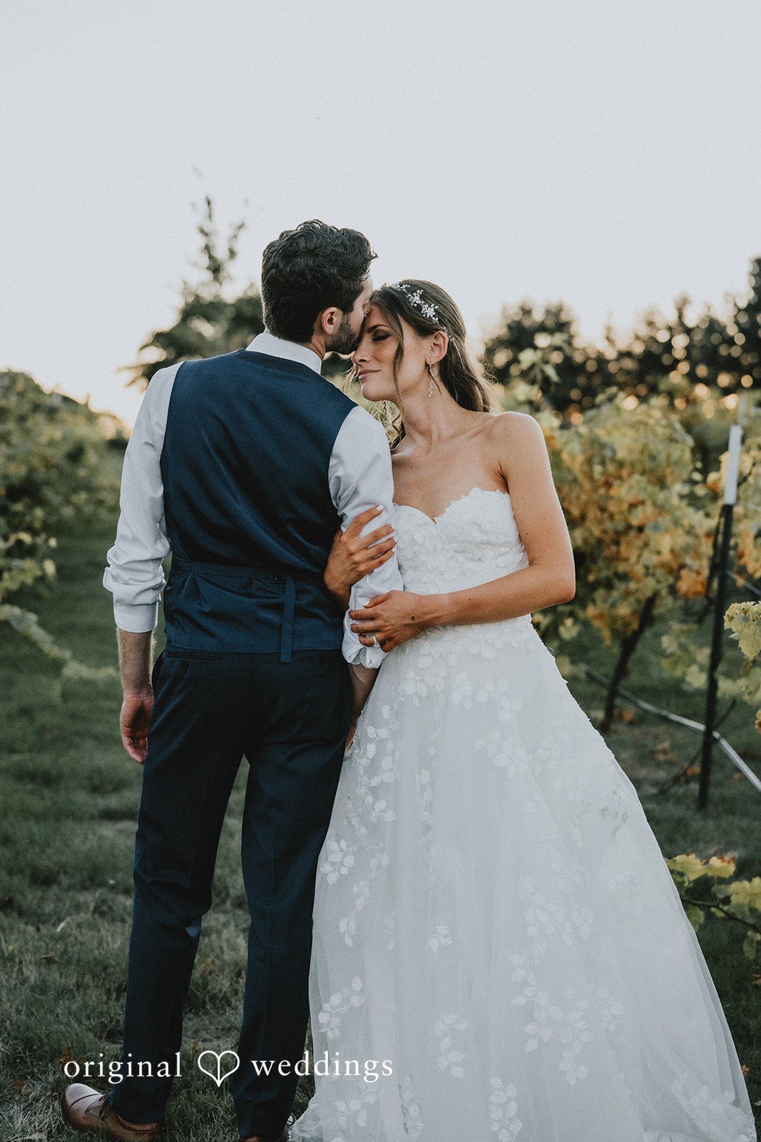 Couple standing close on the lawn