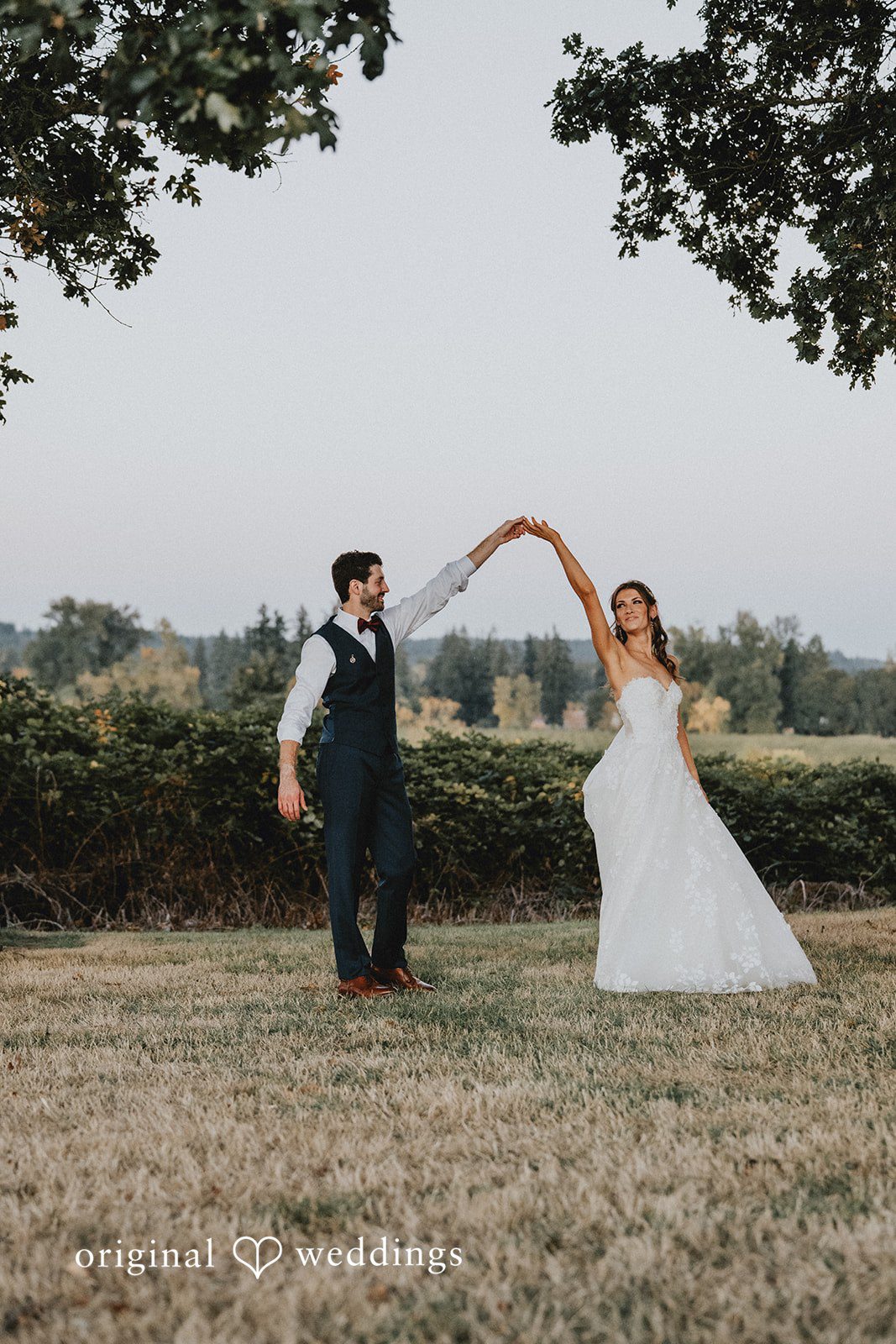 Couple walking across the grounds at Oak & Hood