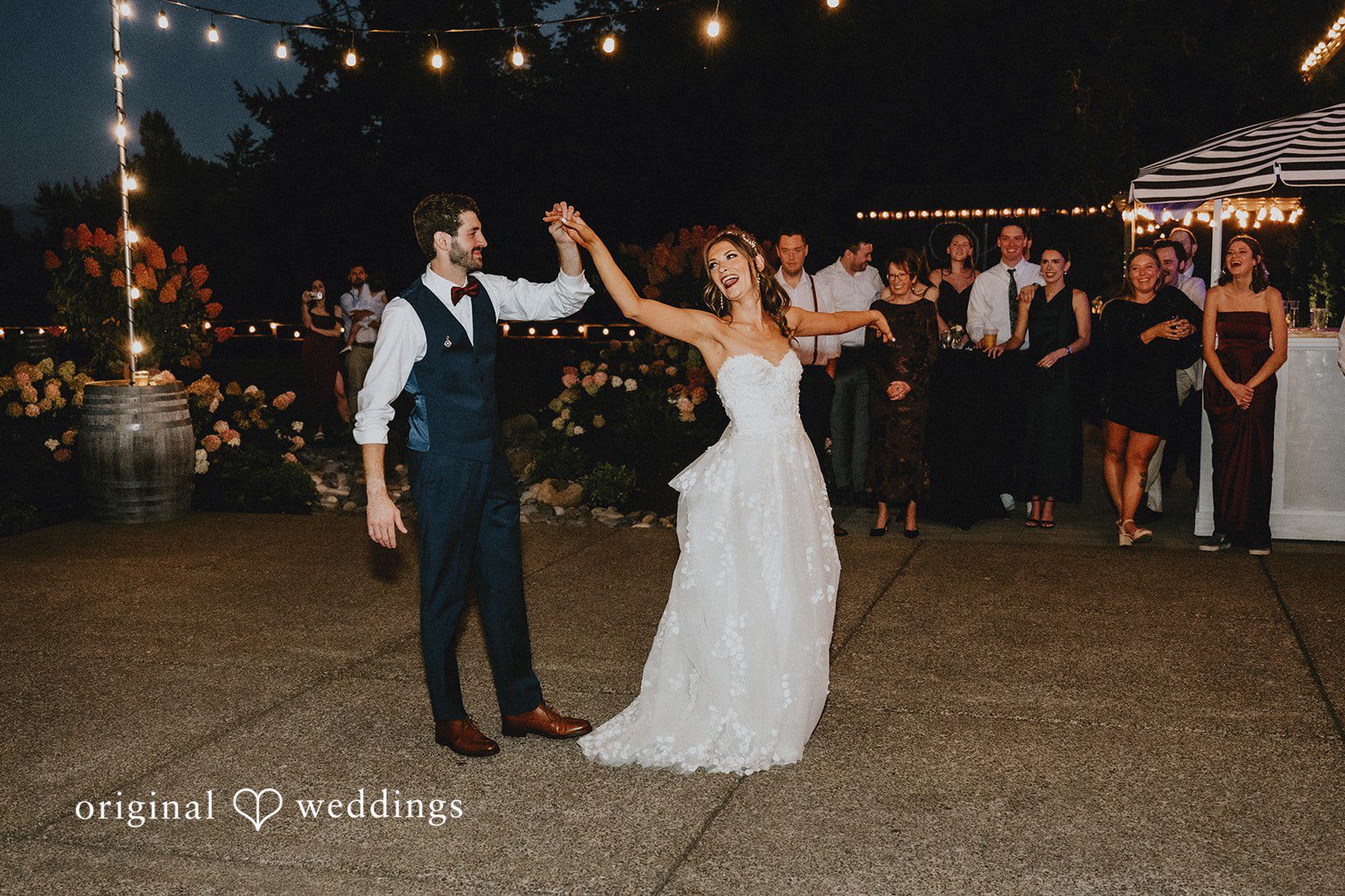 First dance under the string lights at Oak & Hood