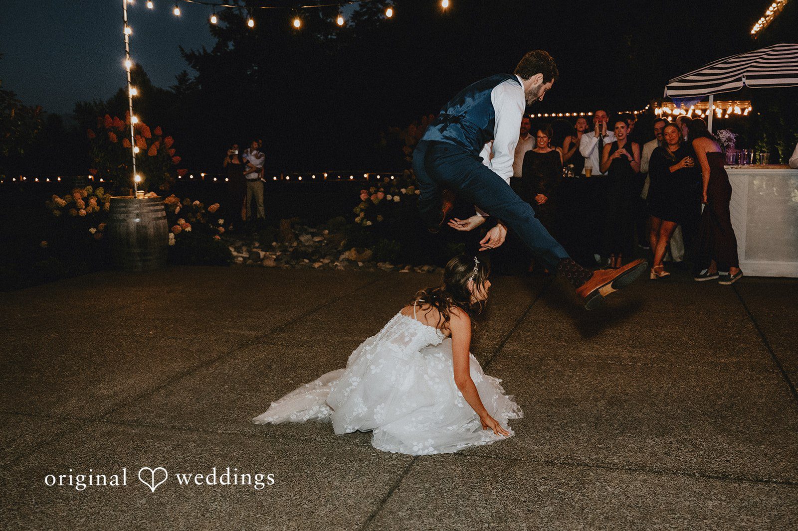 Groom dipping the bride on the dance floor