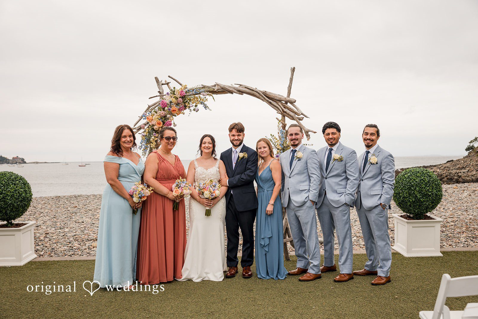 Francesca + Steven Our Boston wedding photographers at Original Weddings captured a beautiful portrait of the couple with their bridal party at Oceanview of Nahant