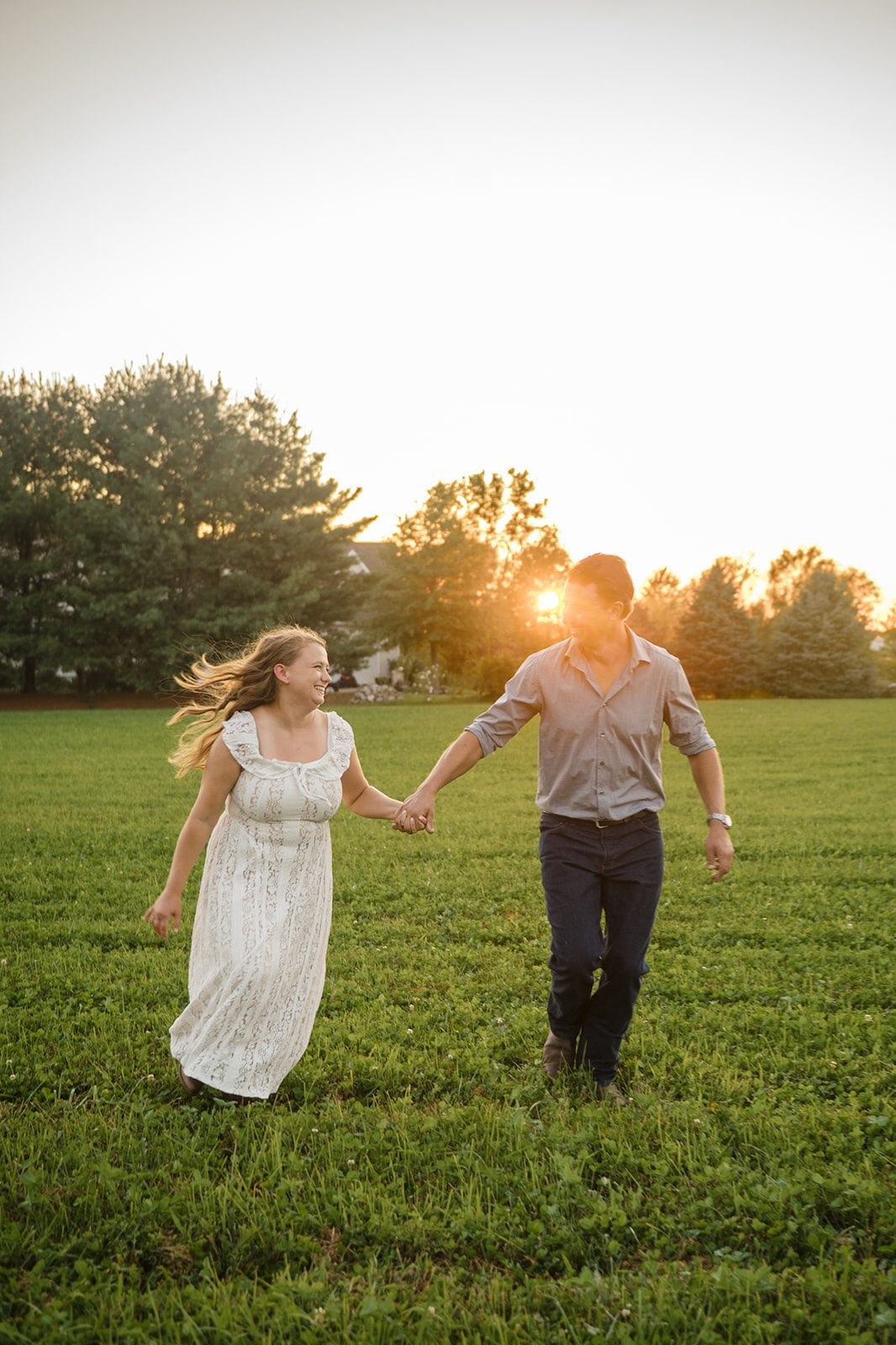 ohio-backyard-timeless-cleveland-madison-maxx-013-16 Couple walking through the field, Engagement Photography Services by Original Weddings in Ohio