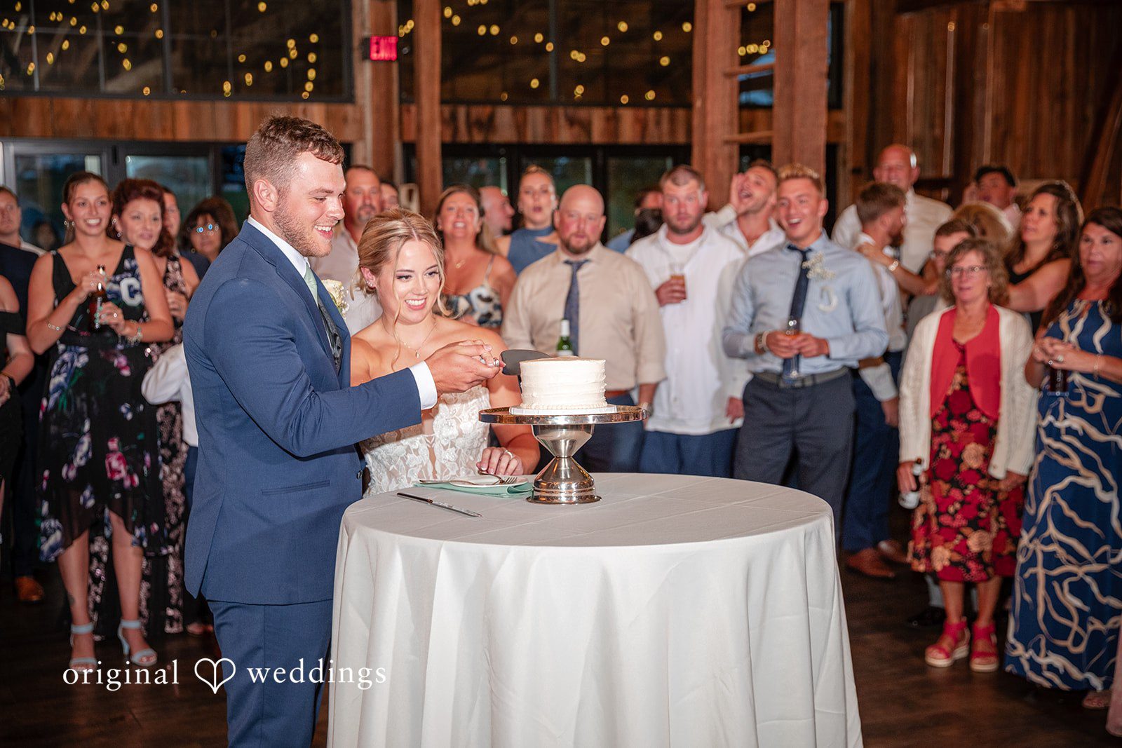 Taylor + Grady The couple cuts their wedding cake