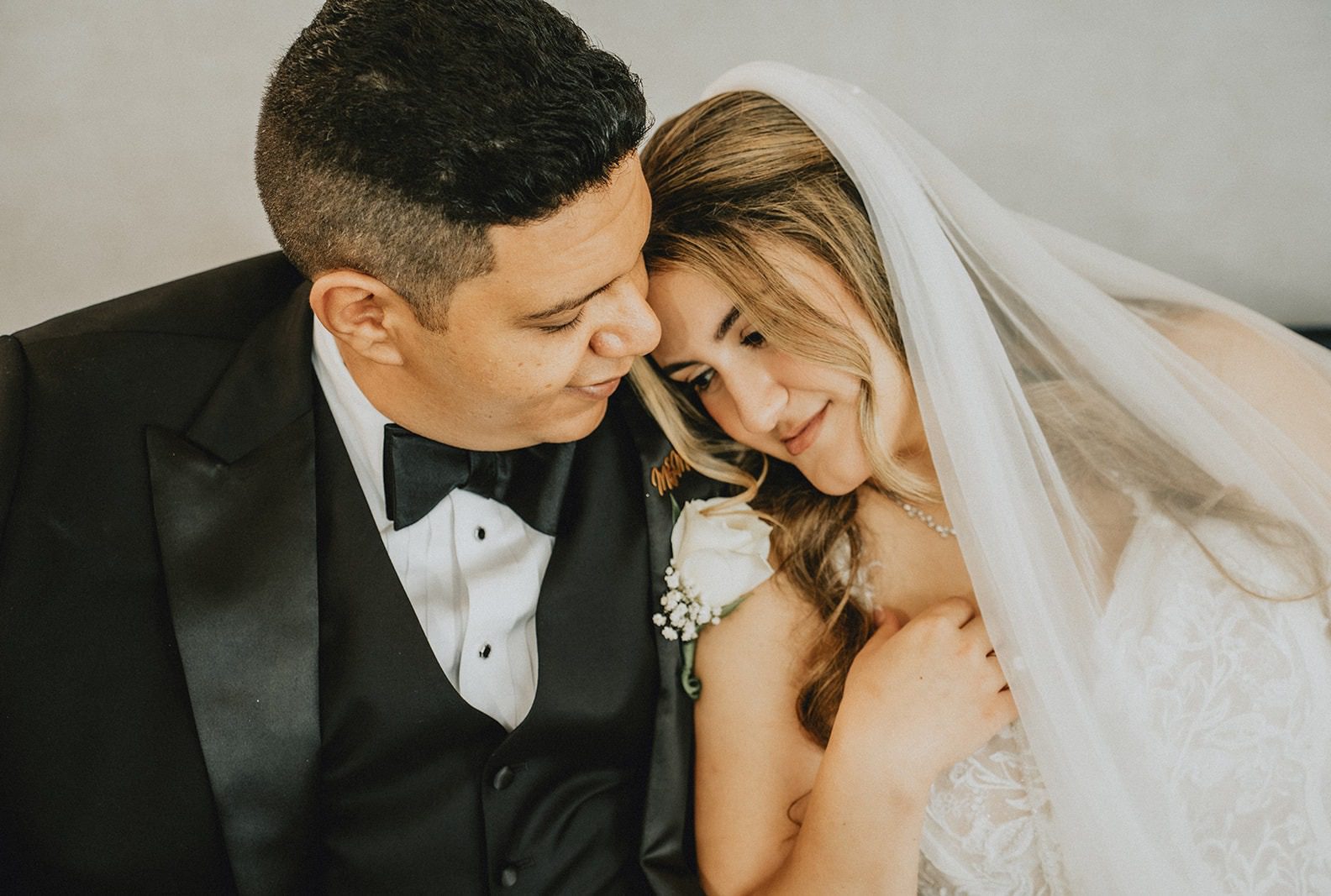 Mena and Marina sharing a tender moment before the ceremony, captured by Raleigh wedding photographers from Original Weddings at Paramount Event Venue