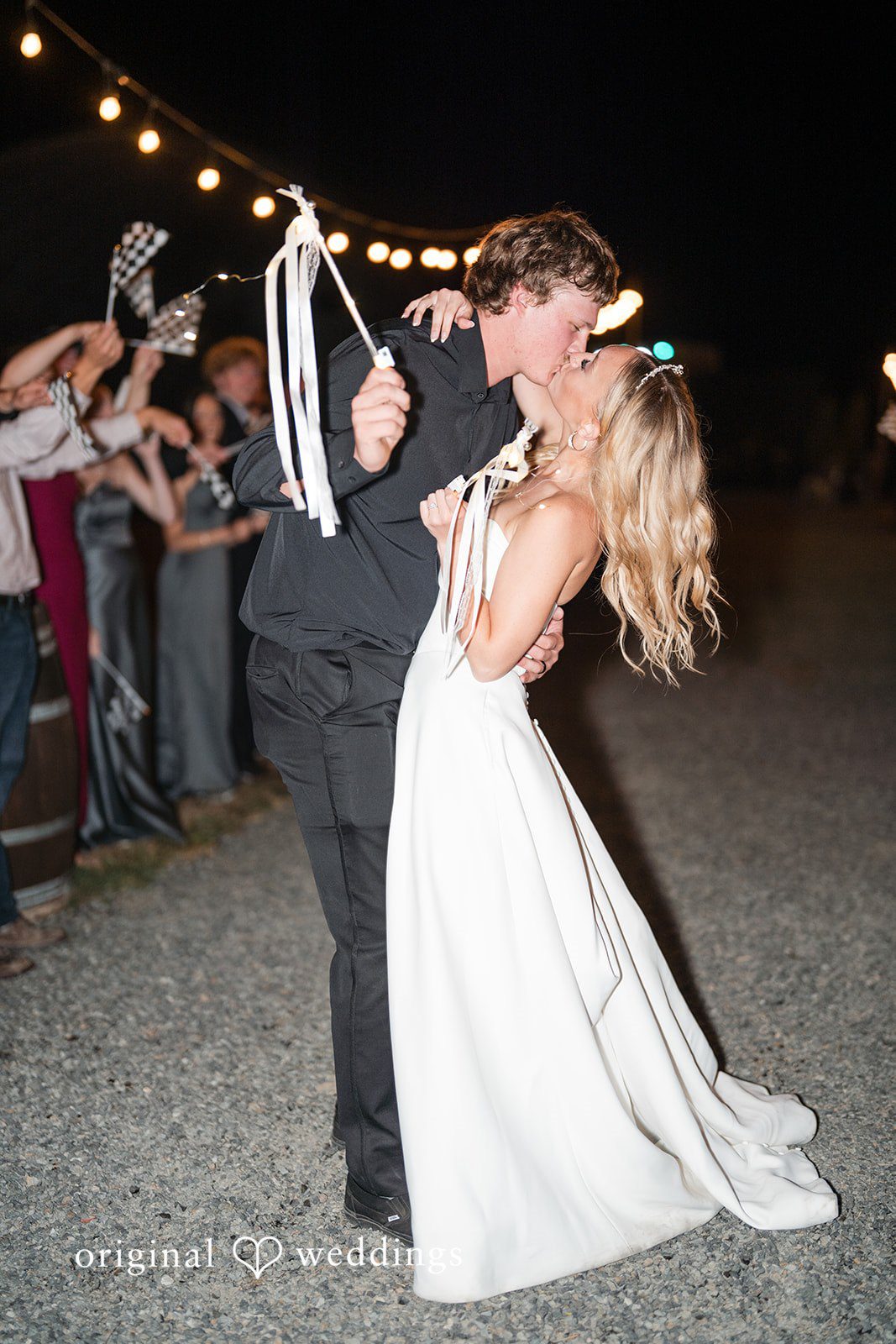 Baylee + Jackson Couple kissing during the send off