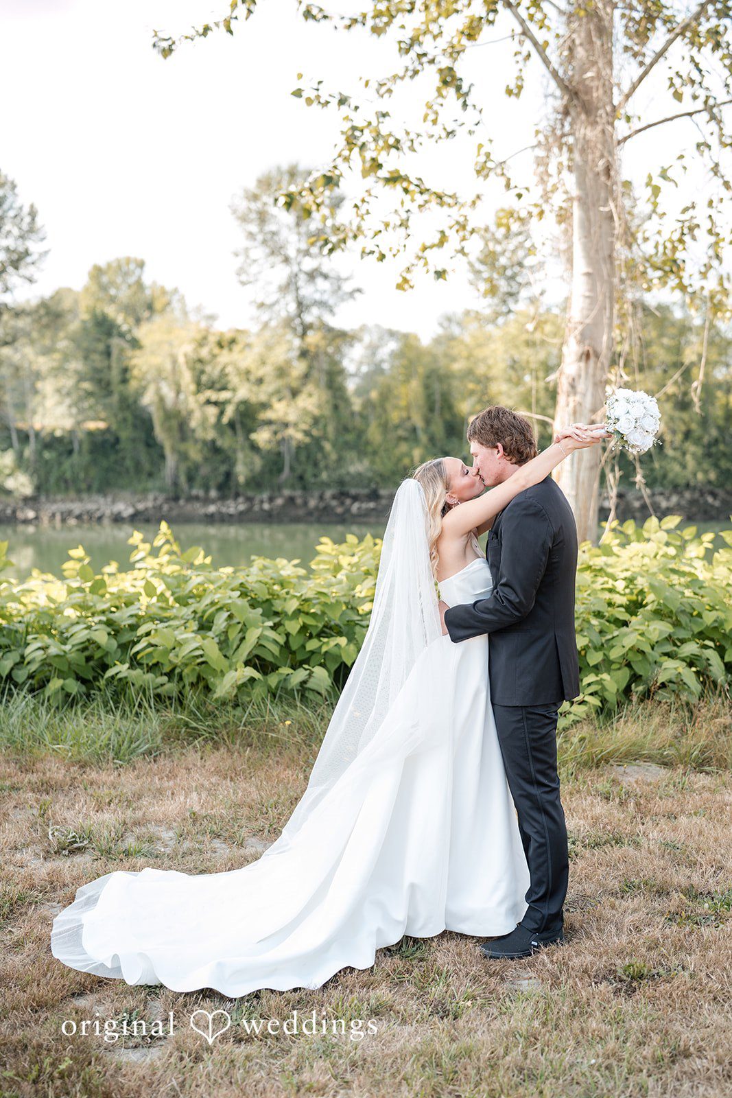 Baylee + Jackson Couple embracing in the field