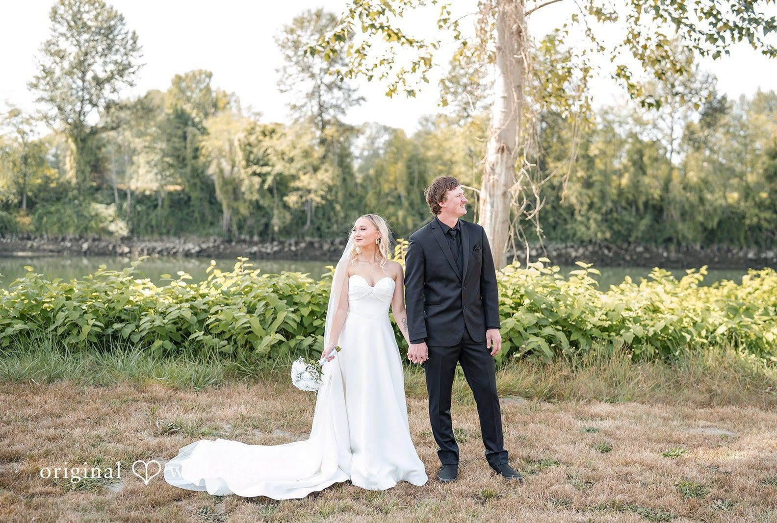 Bride and groom on the farm, captured by Seattle wedding photographers from Original Weddings at Pemberton Farm