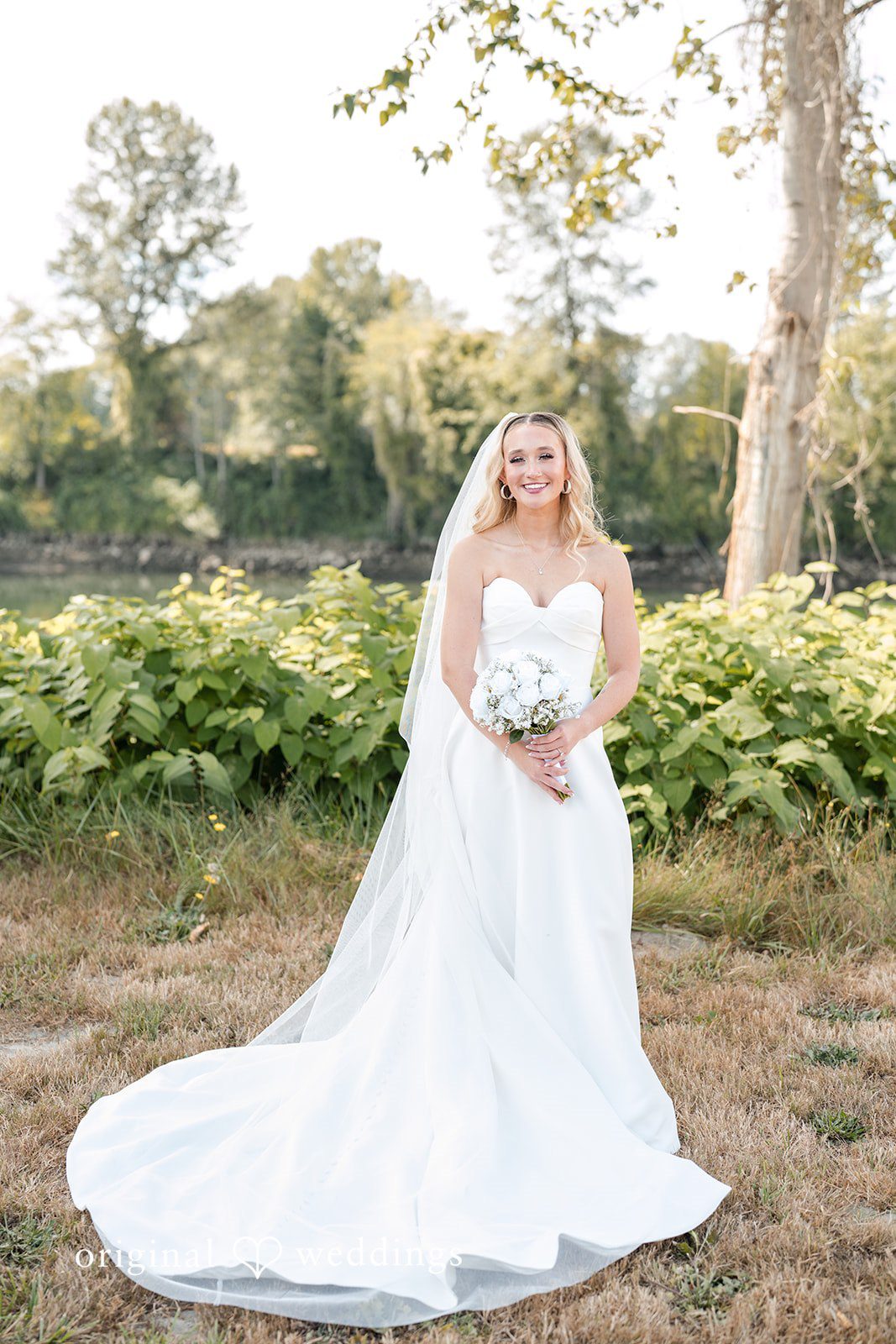 Baylee + Jackson Bride on the farm with her bouquet