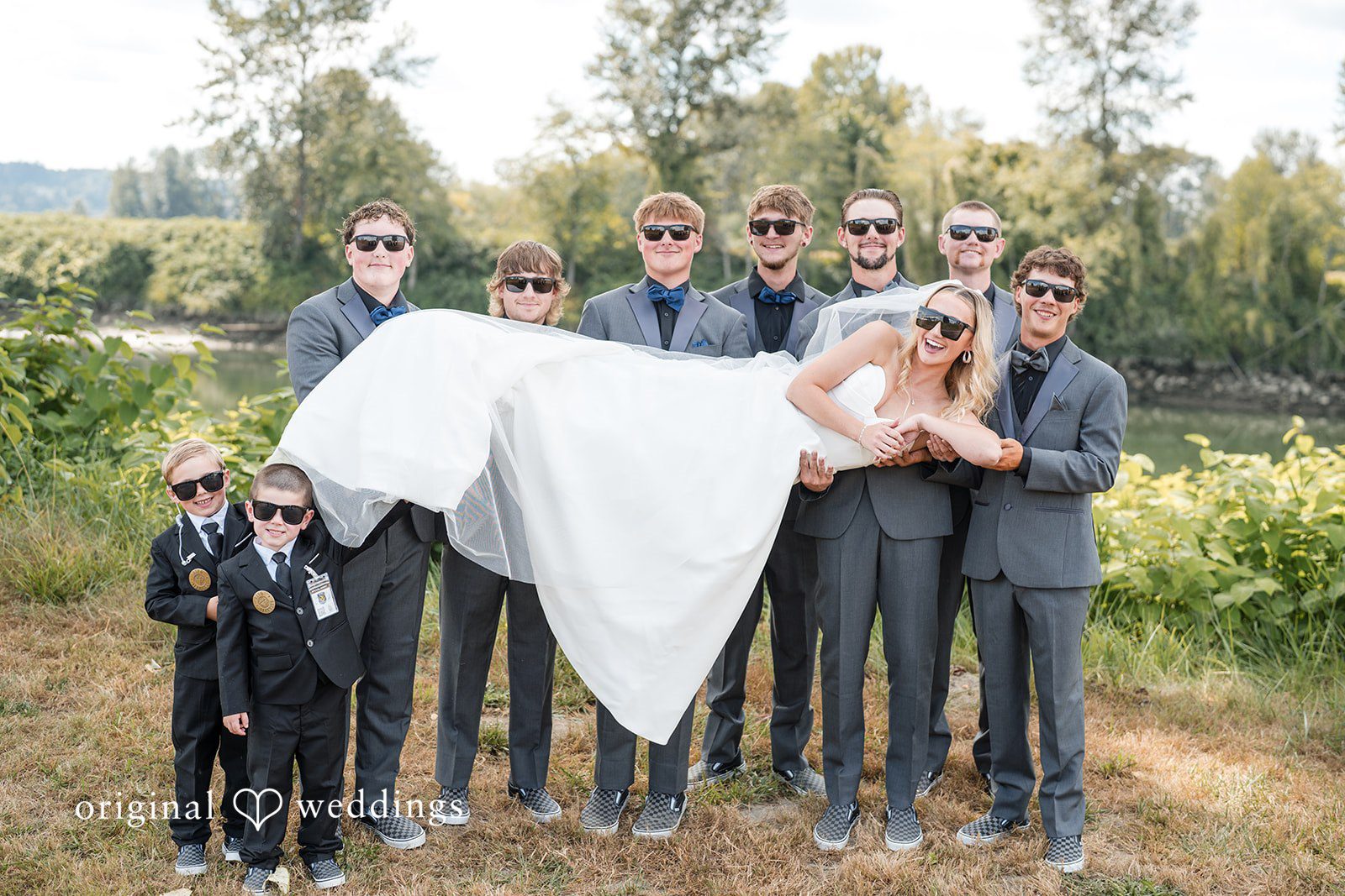 Baylee + Jackson Wedding party lifting the bride