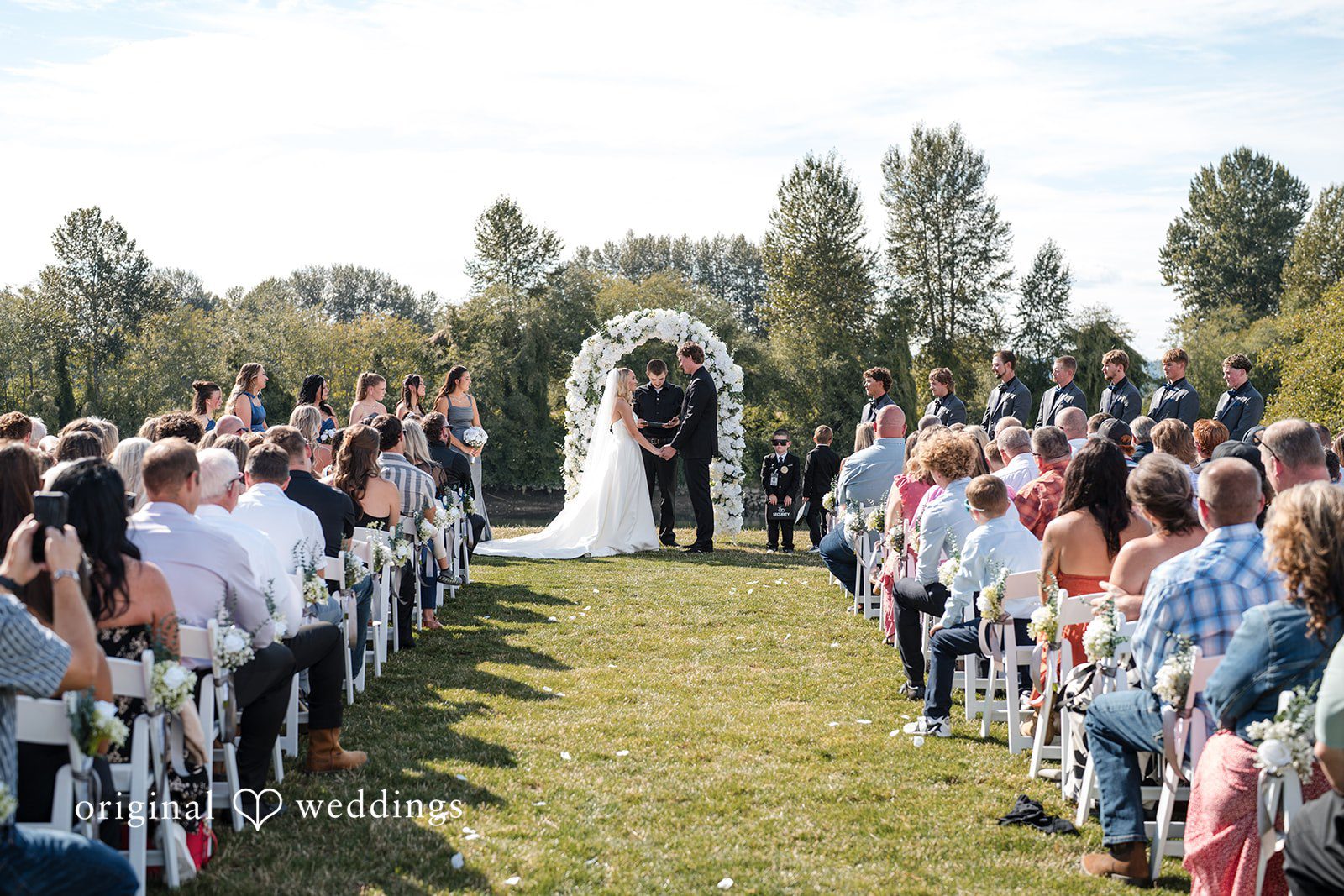 Baylee + Jackson Guests watching from the aisle