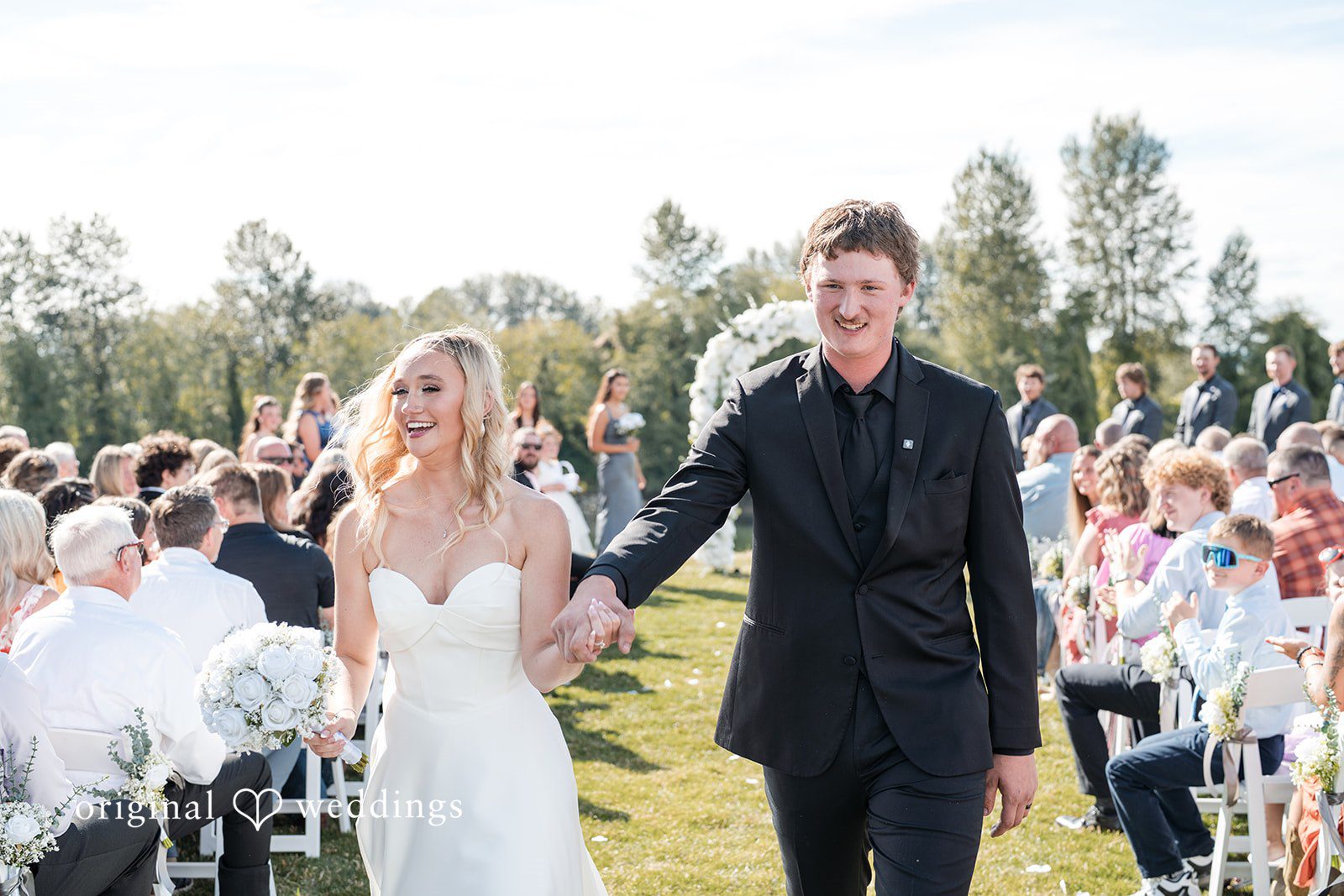 Baylee + Jackson Bride walking down the aisle