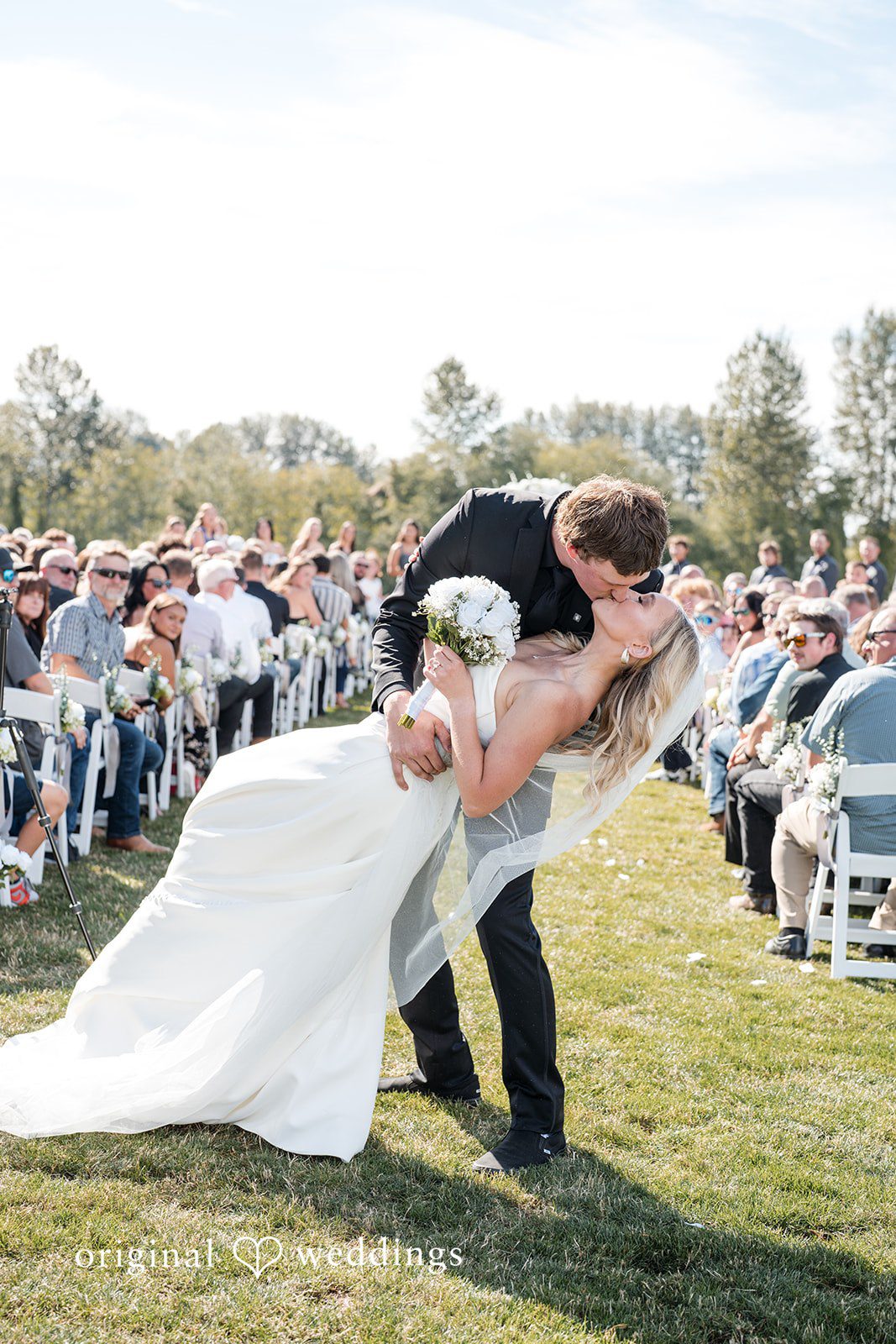 Baylee + Jackson Groom lifting the bride