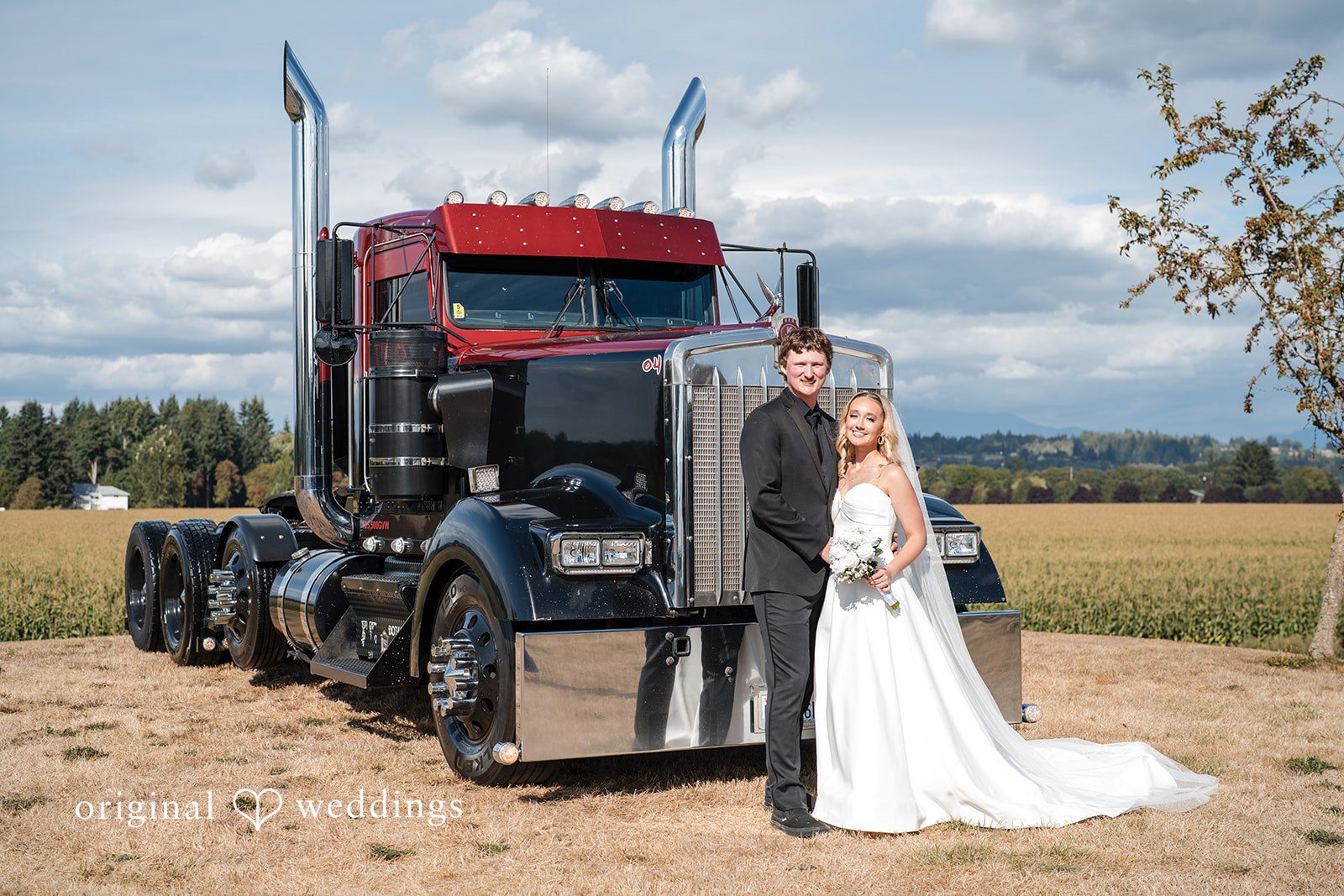 Baylee + Jackson Couple standing in front of a big rig