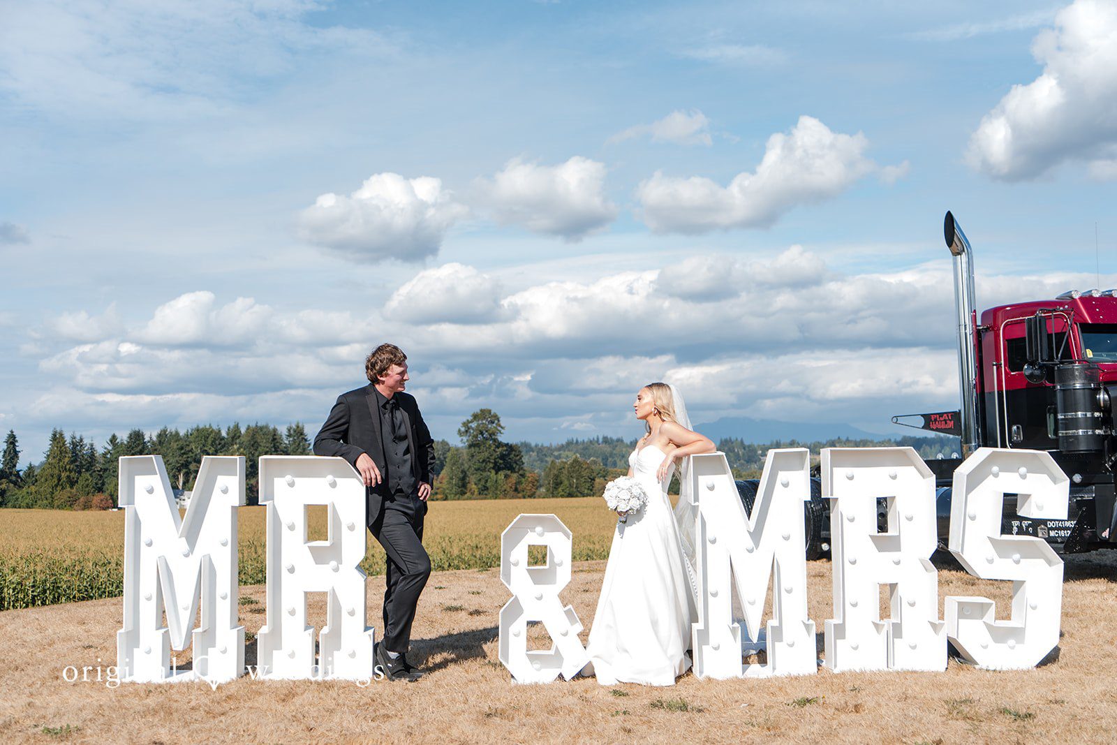Baylee + Jackson Couple behind giant Mr and Mrs letters