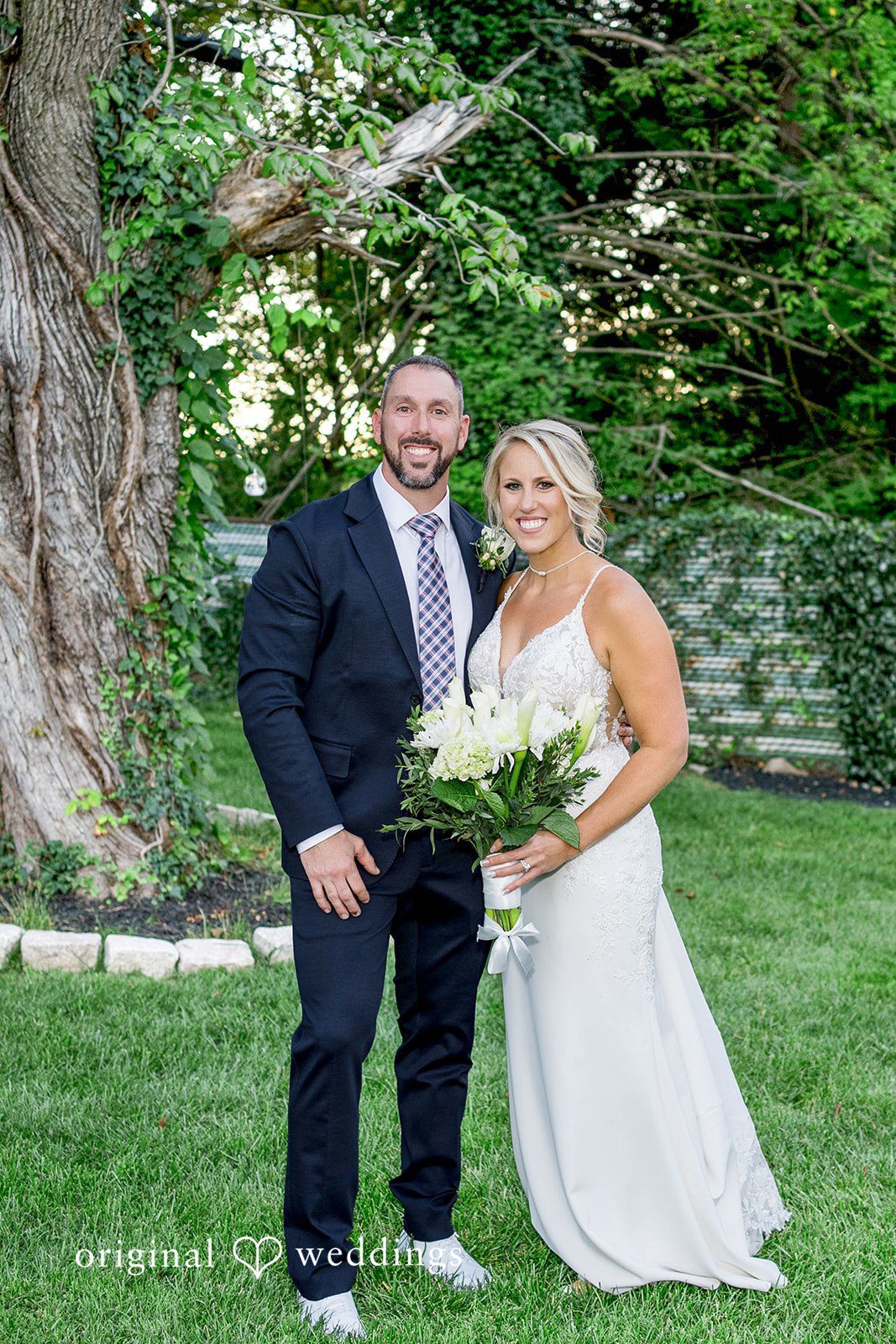August 29, 2026 – Brittany & Vincent – (ID-5826) Bride and groom smiling together on the lawn, captured by Philadelphia wedding photographers from Original Weddings in a Pennsylvania backyard