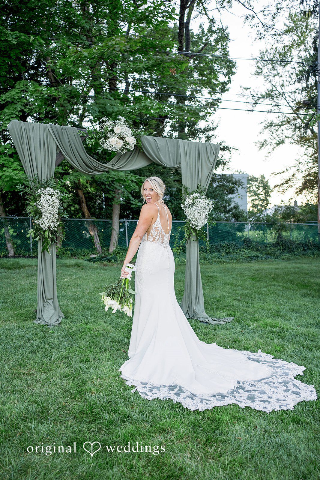 August 29, 2026 – Brittany & Vincent – (ID-5826) Bride standing at the ceremony arch in a Pennsylvania backyard