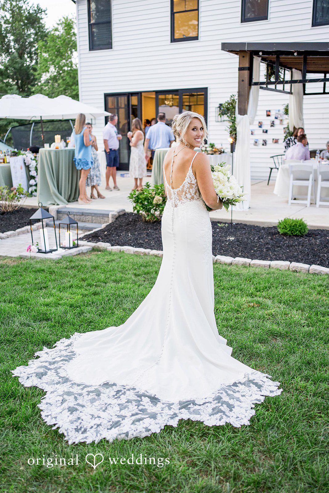 August 29, 2026 – Brittany & Vincent – (ID-5826) Bride's lace train on the lawn