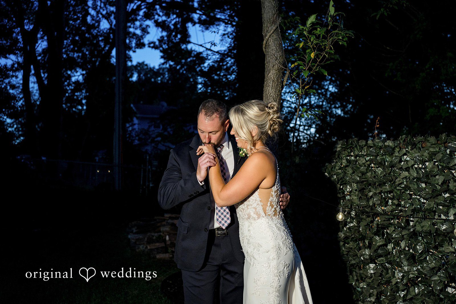August 29, 2026 – Brittany & Vincent – (ID-5826) Groom kissing the bride's hand at night