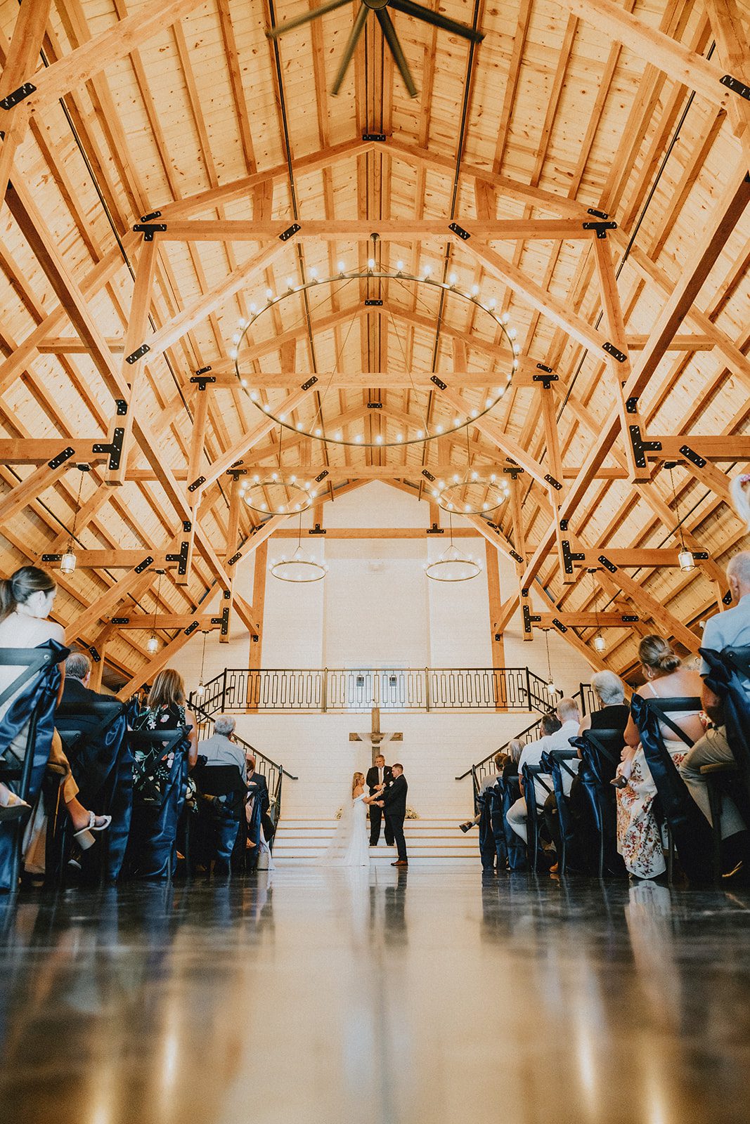 pine-hollow-farms-rustic-st-louis-natalie-john-p001-26 Wooden barn interior with a vaulted ceiling at Pine Hollow Farms
