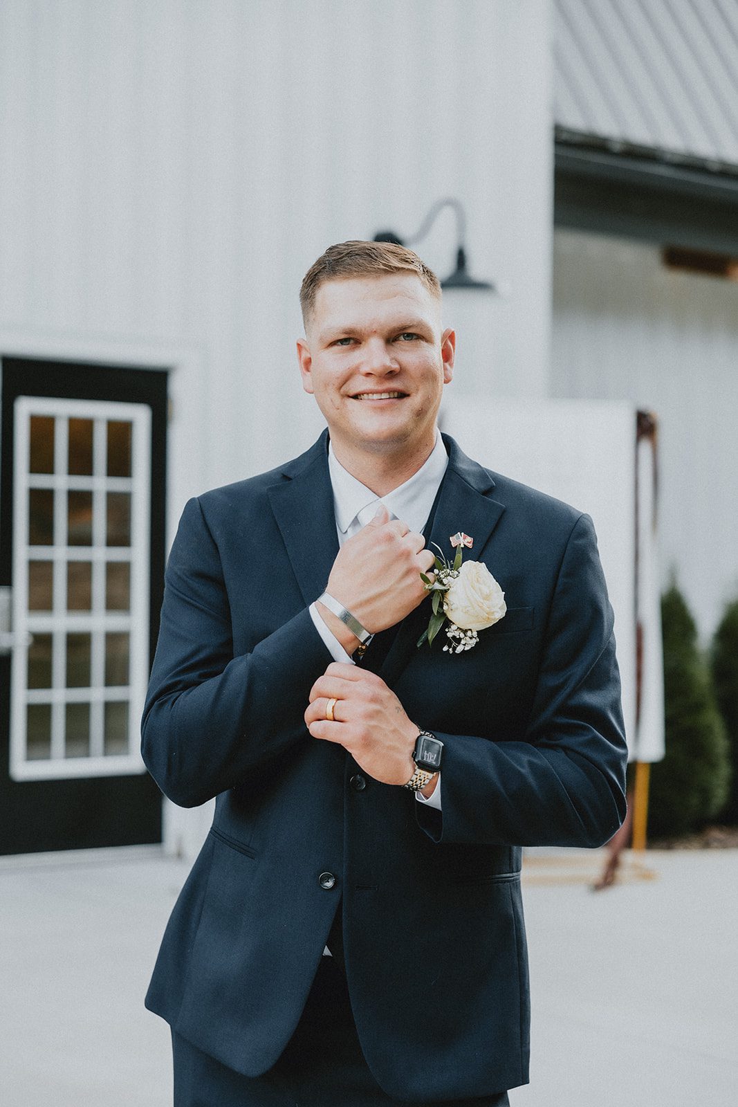 pine-hollow-farms-rustic-st-louis-natalie-john-p013-05 Groom adjusting his boutonniere