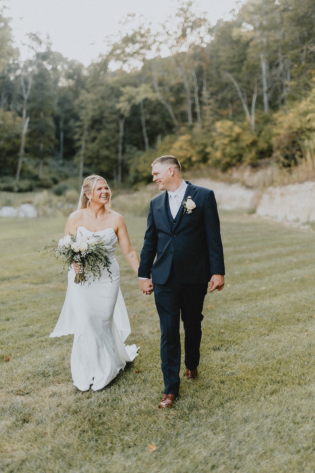 pine-hollow-farms-rustic-st-louis-natalie-john-p026-01 Newlyweds walking hand in hand
