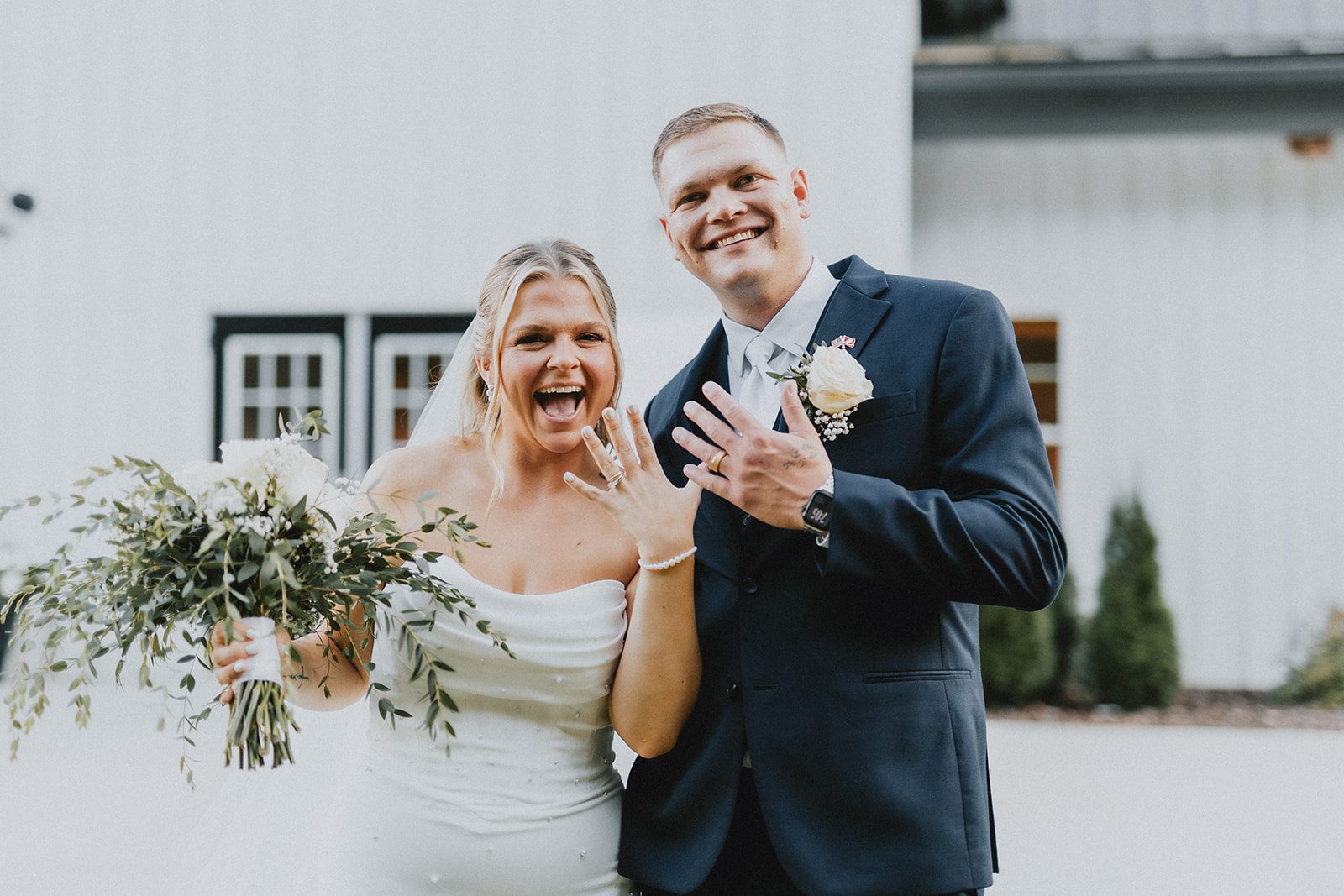 pine-hollow-farms-rustic-st-louis-natalie-john-p027-13 Bride and groom by the white barn, captured by St. Louis wedding photographers from Original Weddings at Pine Hollow Farms