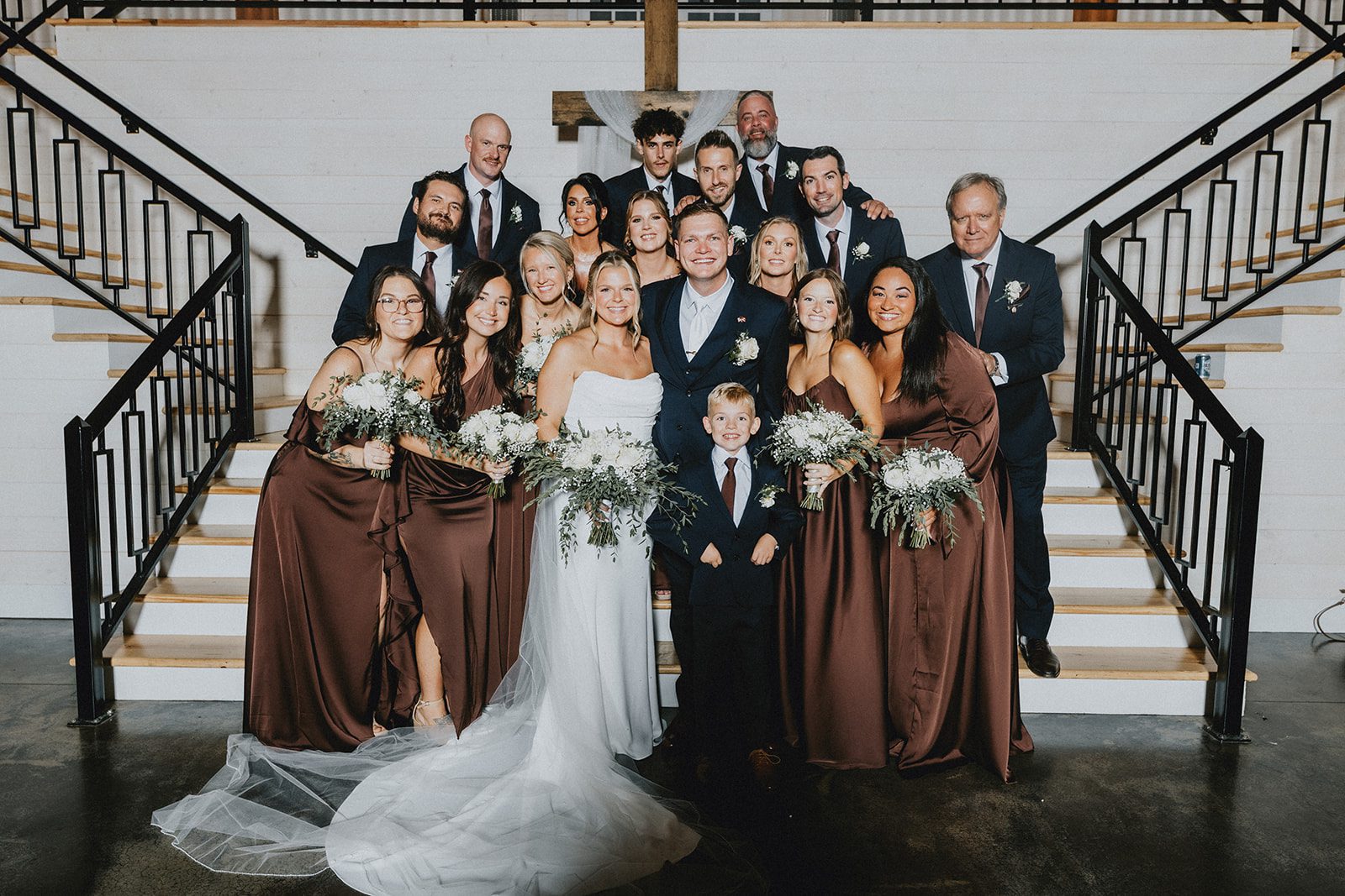 pine-hollow-farms-rustic-st-louis-natalie-john-p028-03 Wedding party gathered on the staircase at Pine Hollow Farms