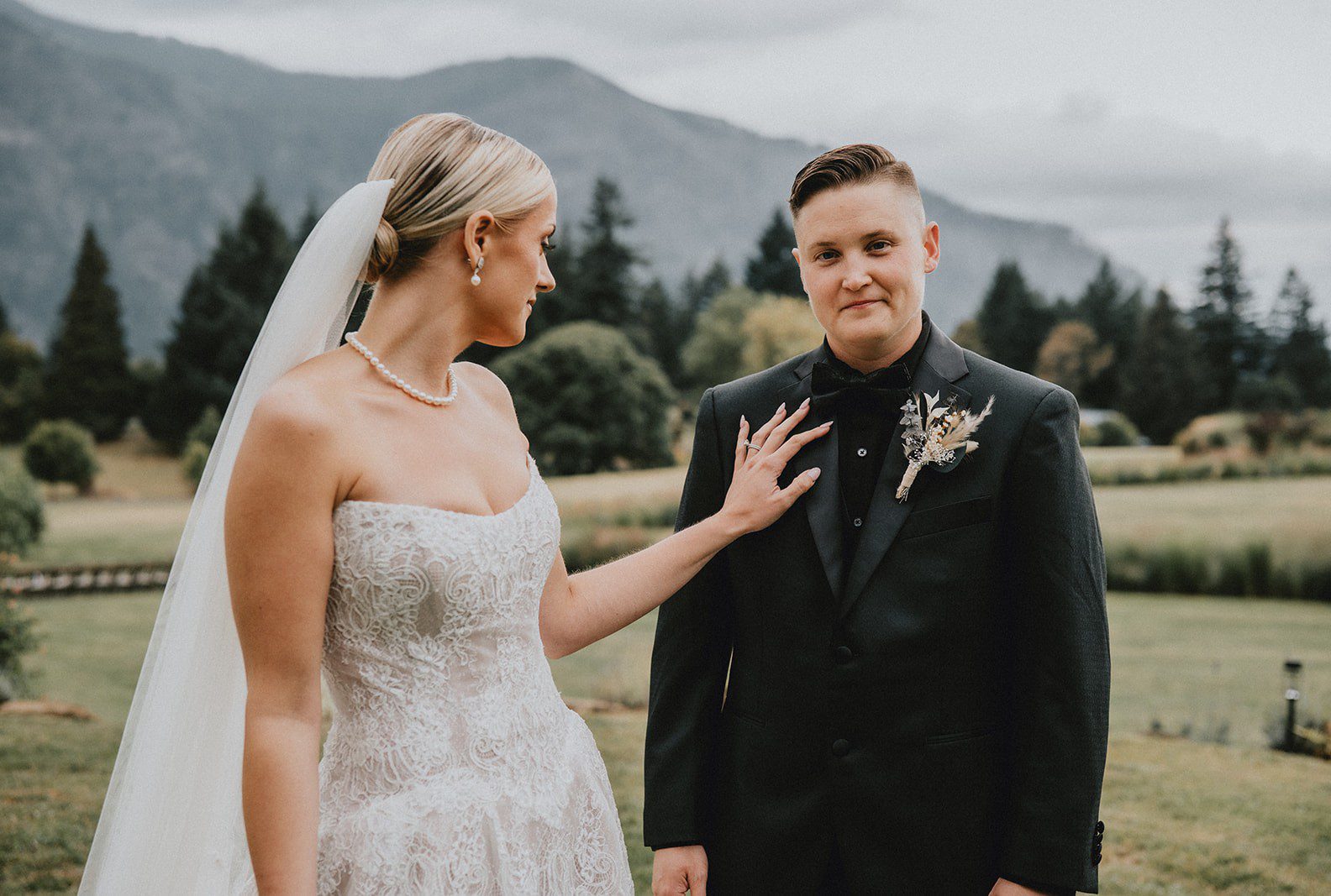 Couple smiling together with mountain views, captured by Portland wedding photographers from Original Weddings at Wind Mountain Ranch