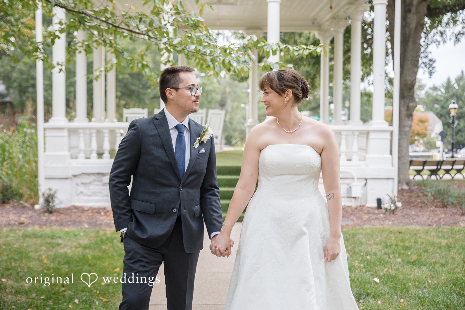 Hannah + Jonathan Hannah and Jonathan smiling together by the white gazebo, captured by Washington DC wedding photographers from Original Weddings at President Lincoln's Cottage