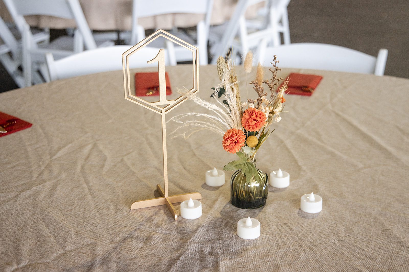 Table centerpiece with candles and fall flowers at Pyramid Hill