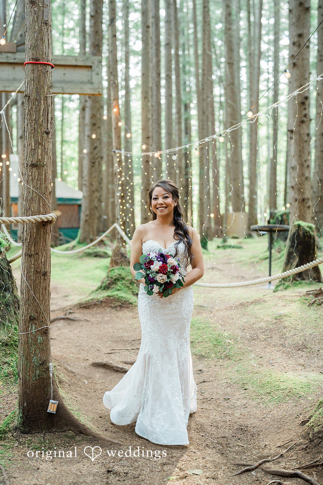 Christopher + Lydia Bride standing on a forest path at Redmond Emerald Forest