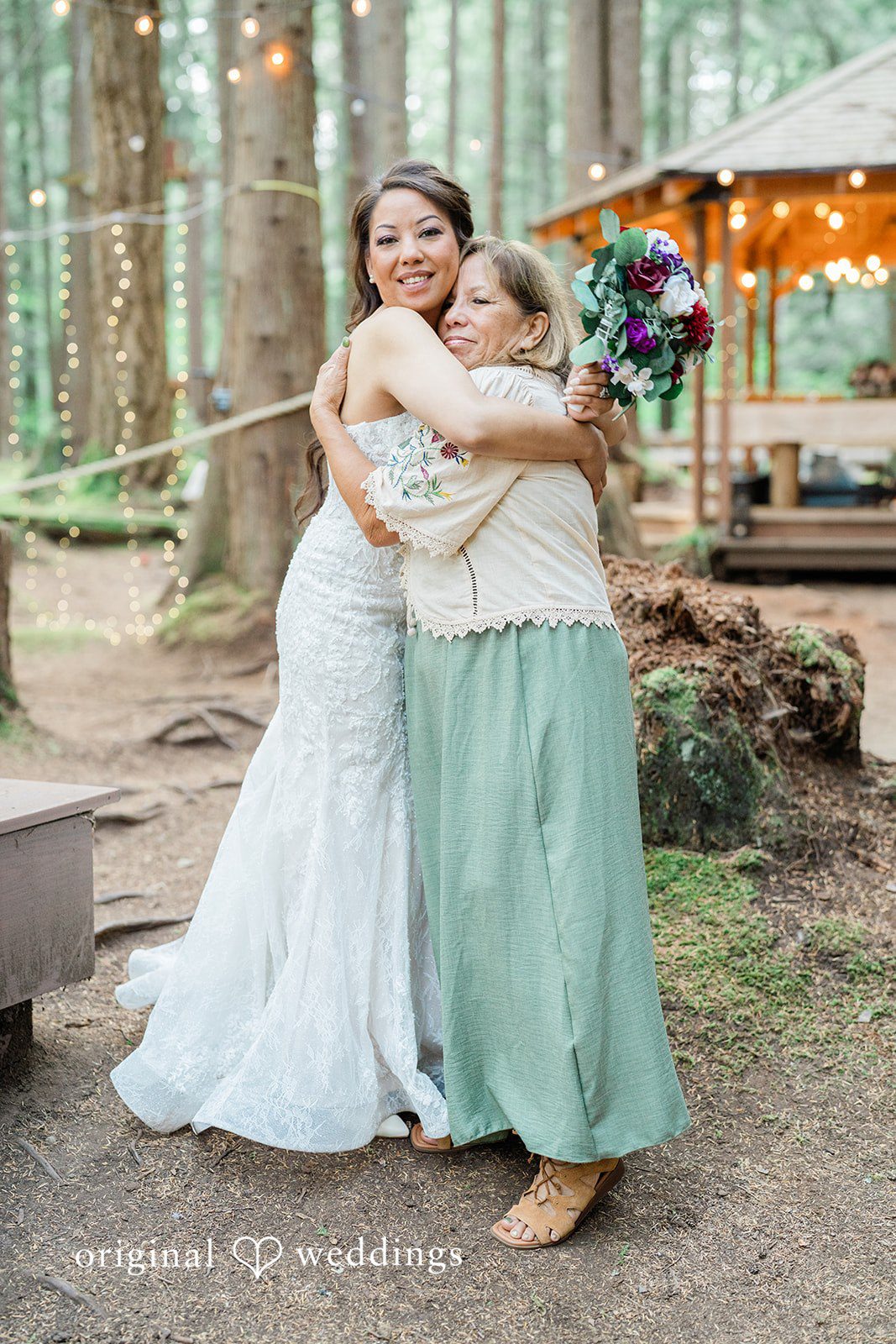 Christopher + Lydia Bride hugging her bridesmaid