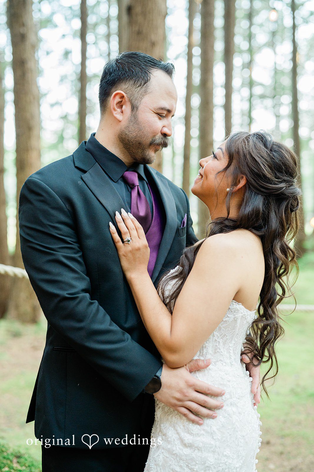 Christopher + Lydia Couple embracing with soft forest light