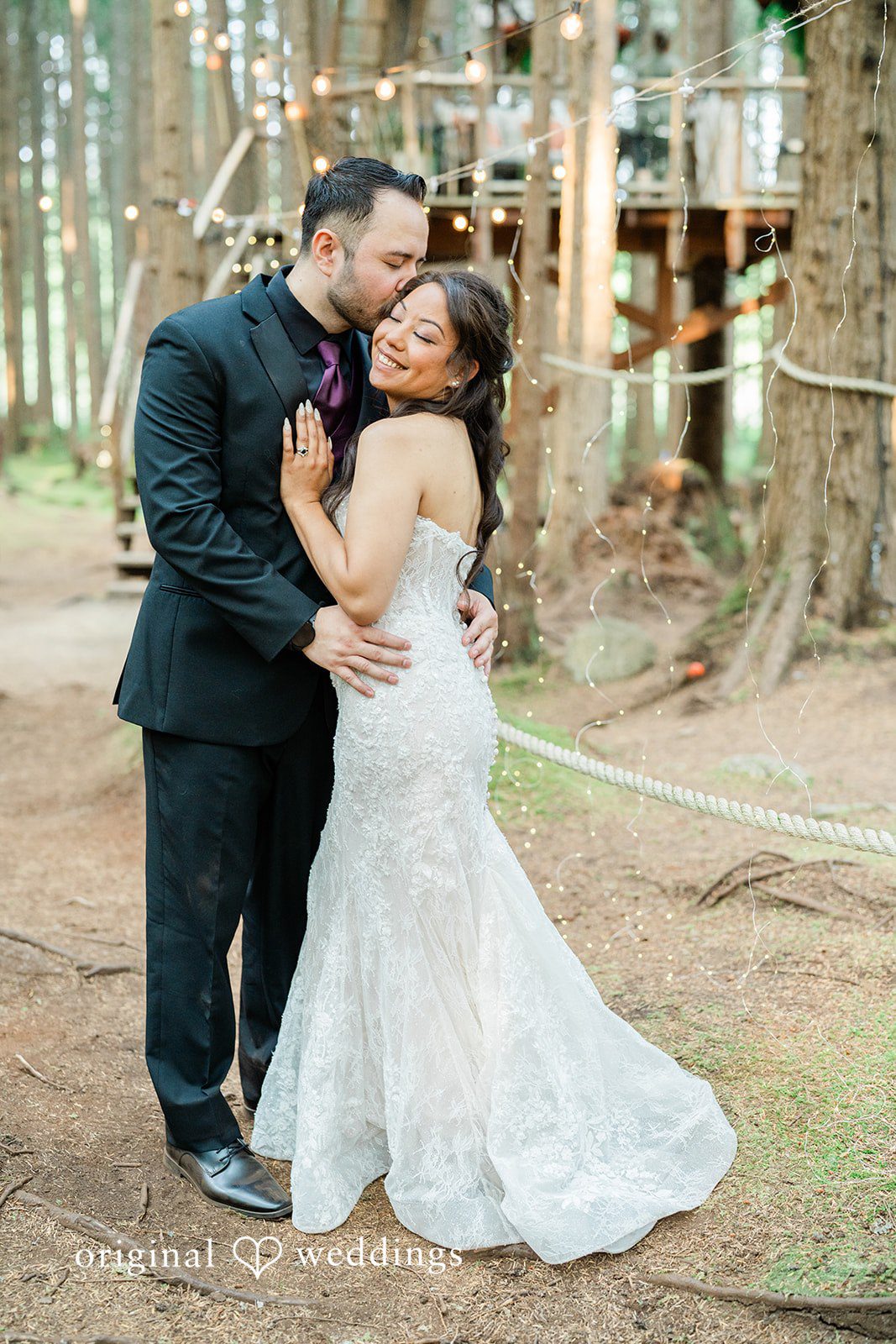 Christopher + Lydia Couple standing close in the forest