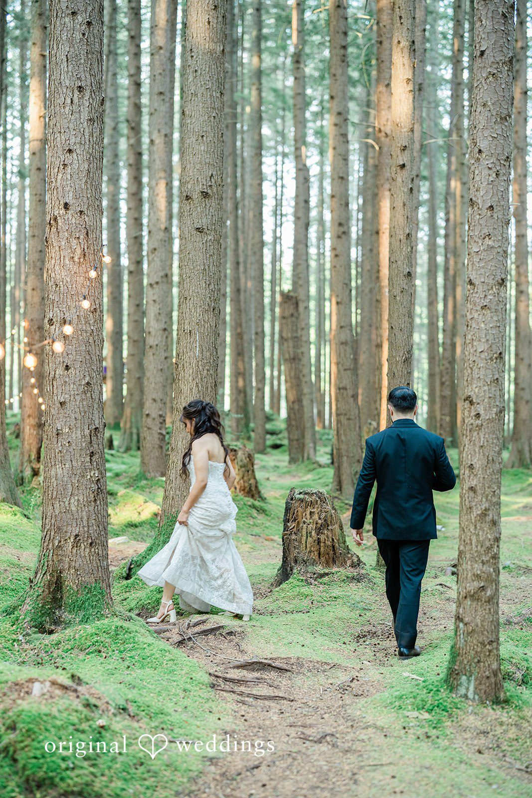 Christopher + Lydia Couple walking along a forest trail
