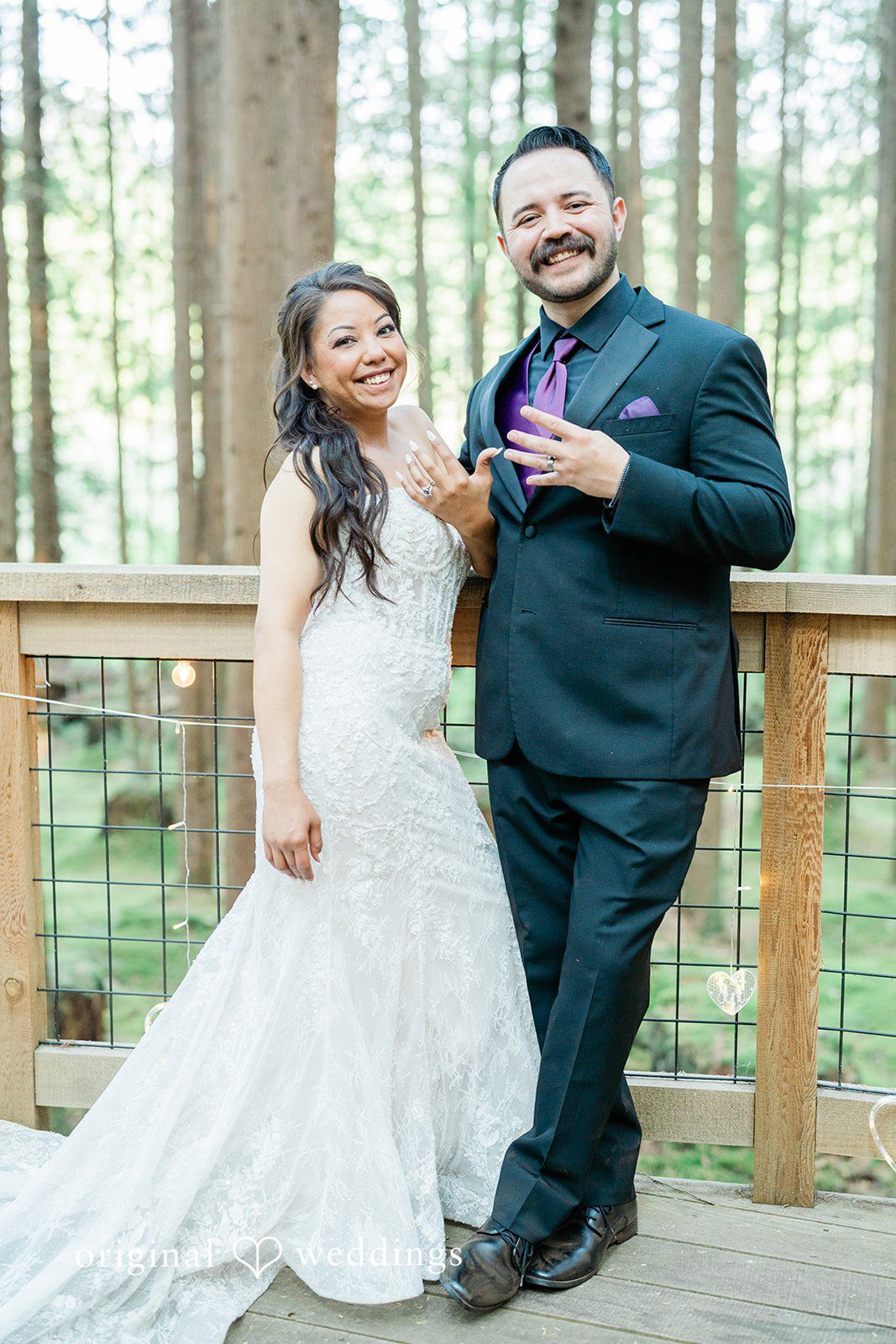 Christopher + Lydia Couple posing on the deck at Redmond Emerald Forest