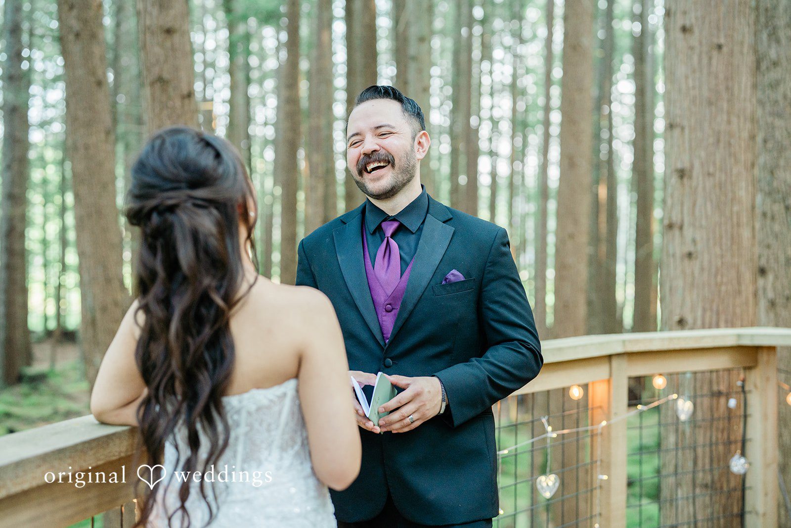Christopher + Lydia Couple laughing while reading their vows