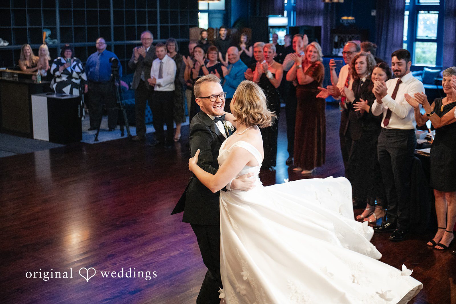 Couple dancing with family and friends