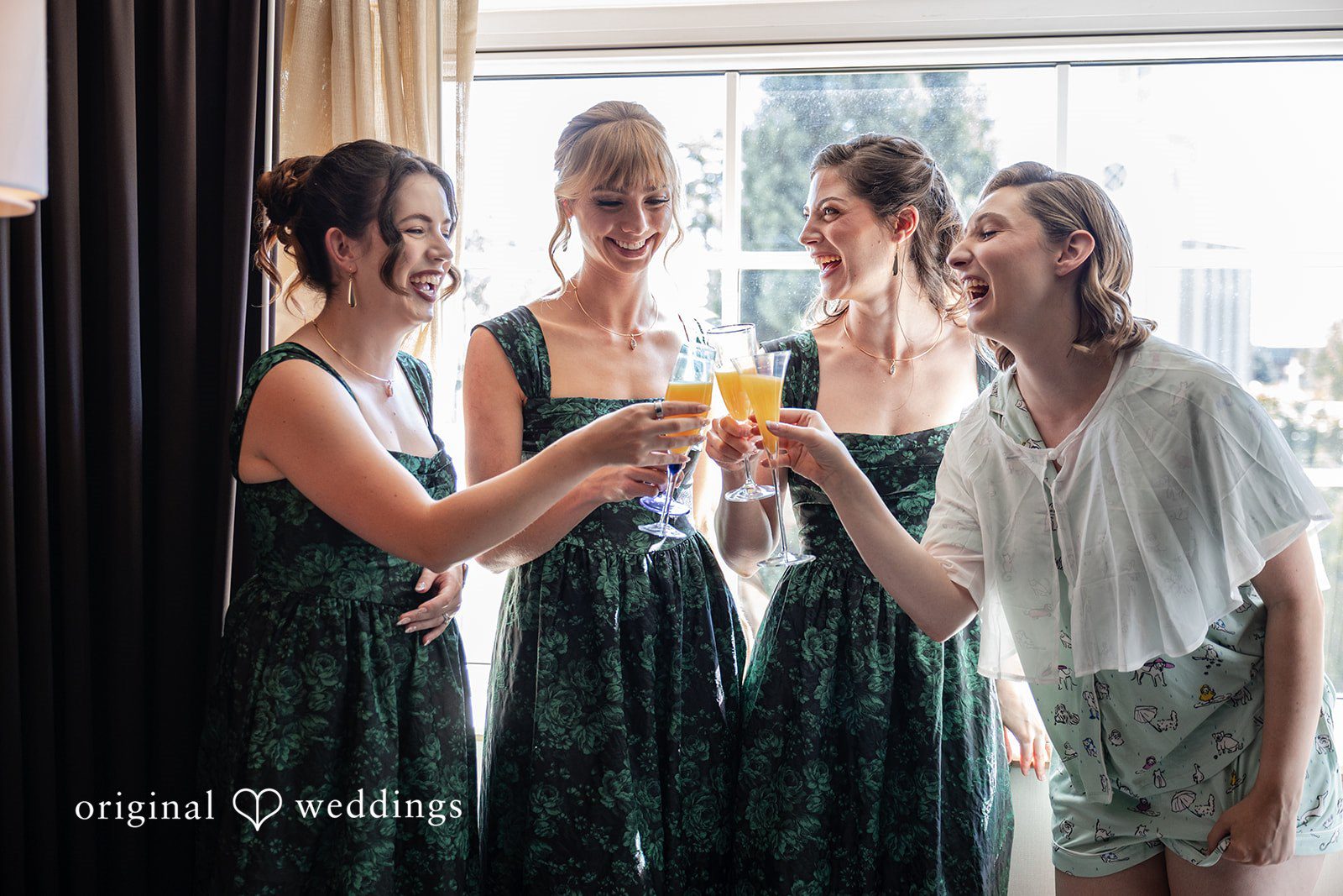 Bridesmaids toasting with the bride before the ceremony
