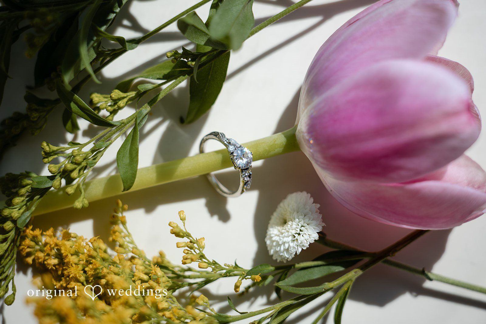 Pink tulips and greenery in the wedding florals