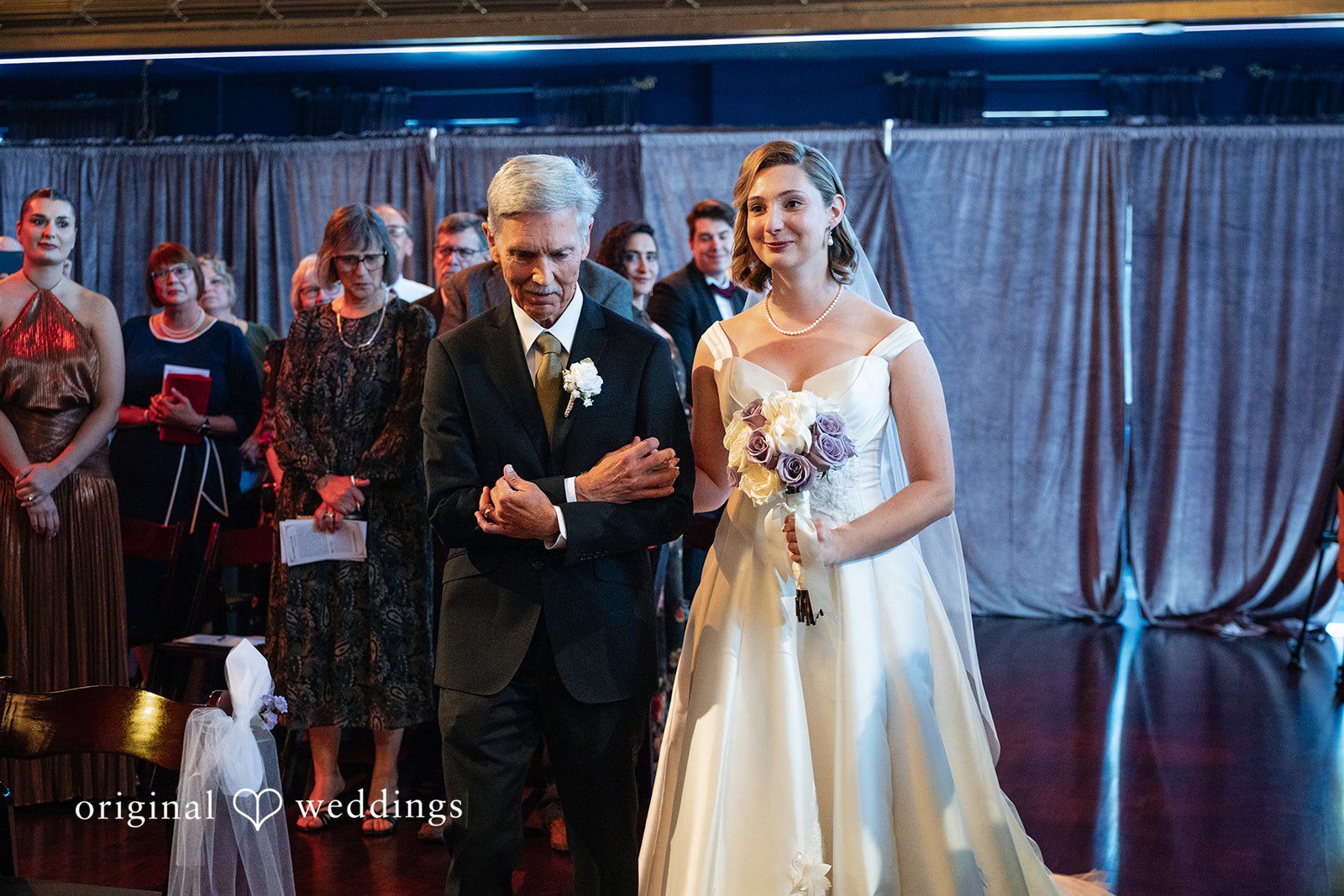 Couple greeting guests at the reception