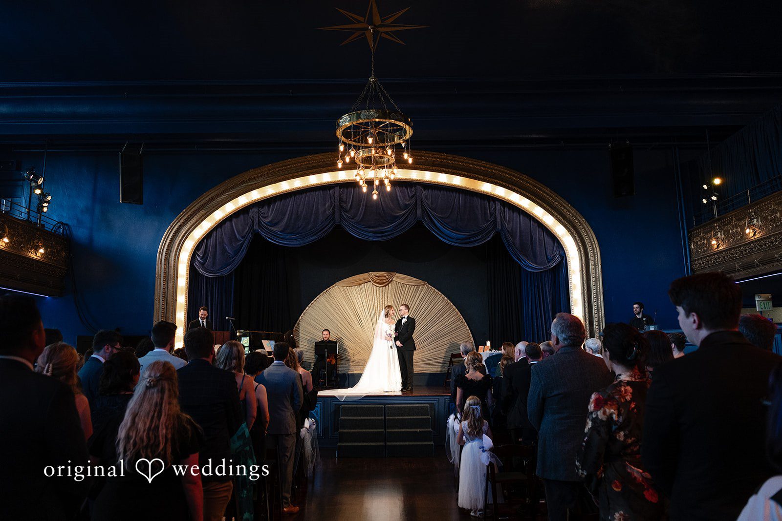 Stage with blue lighting inside Reverie Ballroom