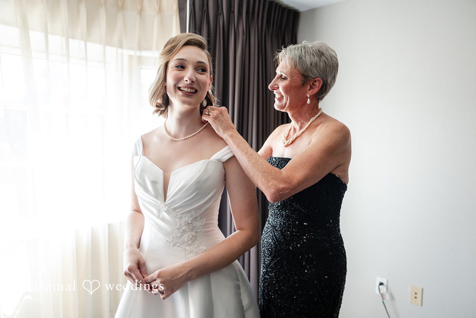 Bride getting ready with her mother