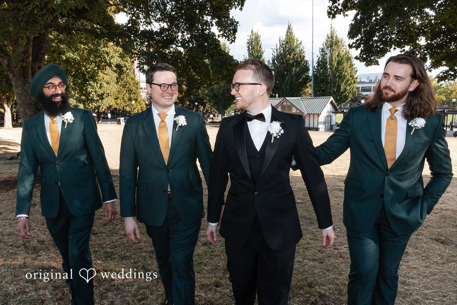 Groom walking with his groomsmen outdoors